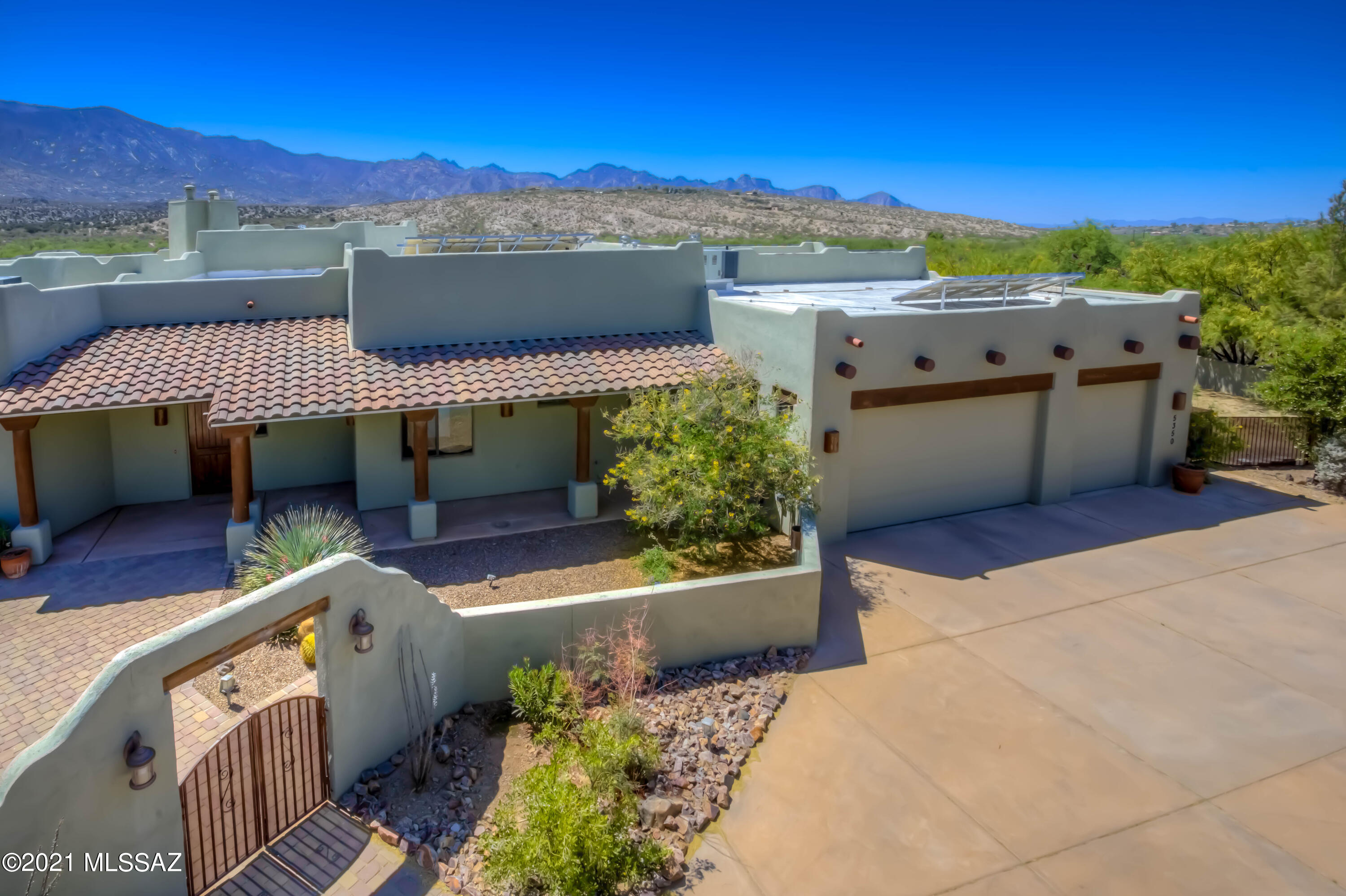 STUNNING CUSTOM HOME WITH BREATHTAKING VIEWS!! Situated against the Catalina Mountains and Miraval Resort and Spa, this 4 bed/3.5 bath home on a 1 acre lot will exceed your expectations! Enter through a front courtyard into a spacious Great Room with beamed ceilings!  The generous Primary Bedroom boast of a fireplace & luxurious en suite travertine-studded bathroom w/soaking tub, walk-in shower and a California closet! Entertain in the gourmet chef's kitchen with Jen Air appliances, curved island and custom alder cabinetry throughout.  Guest wing includes 2 bedrooms, each w/en suite travertine bathrooms and private patio access.   SPECTACULAR VIEWS FROM EVERY ROOM!! Venture out back to your private oasis with Koi Pond/waterfall, pool, outdoor kitchen and panoramic VIEWS! See More... 4th Bedroom is currently being used as an office with custom built-ins.  Huge 3-car garage with storage and cabinets, fully enclosed yards with double gates on each side for all of your toys or horses!  Close to BASIS school, medical facilities, shopping/dining, vineyards and endless trail systems/National Forest access.  Solar is owned. Shared Well Agreement.  Septic. NO HOA! Owner has invested $100K in upgrades since purchasing the home.
