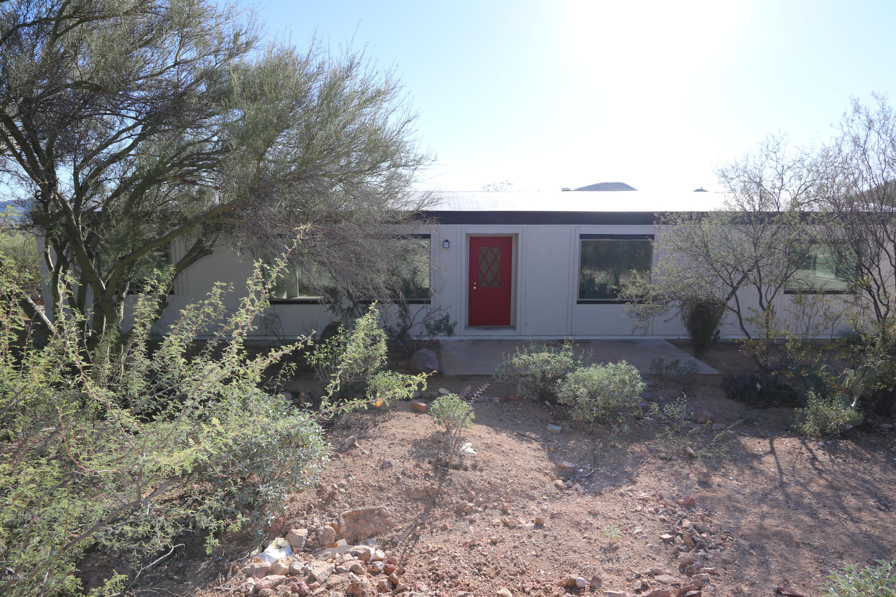 Gorgeous mountain and sunset views from this 2.5 acre lot with manufactured home.   Beautiful  natural wildlife and vegetation.  Contemporary plank flooring, stainless steel appliances, fresh interior and exterior paint. A must see!