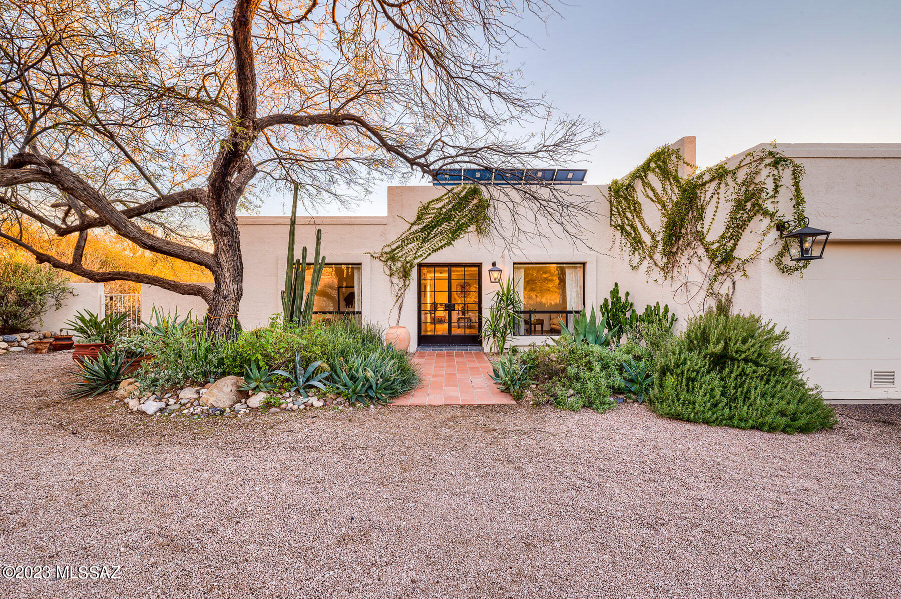 This Foothills desert sanctuary offers privacy, city & mountain views, custom designed features utilizing regional and international finishes, and mindful energy conservation including solar and water harvesting. The secluded driveway opens to a gorgeous front elevation with mature landscaping, large windows, and lovely entrance. Cascades of light fill the home with high ceilings and views from each window. Thoughtful amenities include; French limestone counters, updated kitchen & baths, floor to ceiling wall tile, open shelving, custom light fixtures, and tile flooring throughout. The back yard offers peaceful views of the desert, city, and sunset from the patios or garden, and there's plenty of room for a pool or additional living space. See docs for additional information. Owner/Agent.