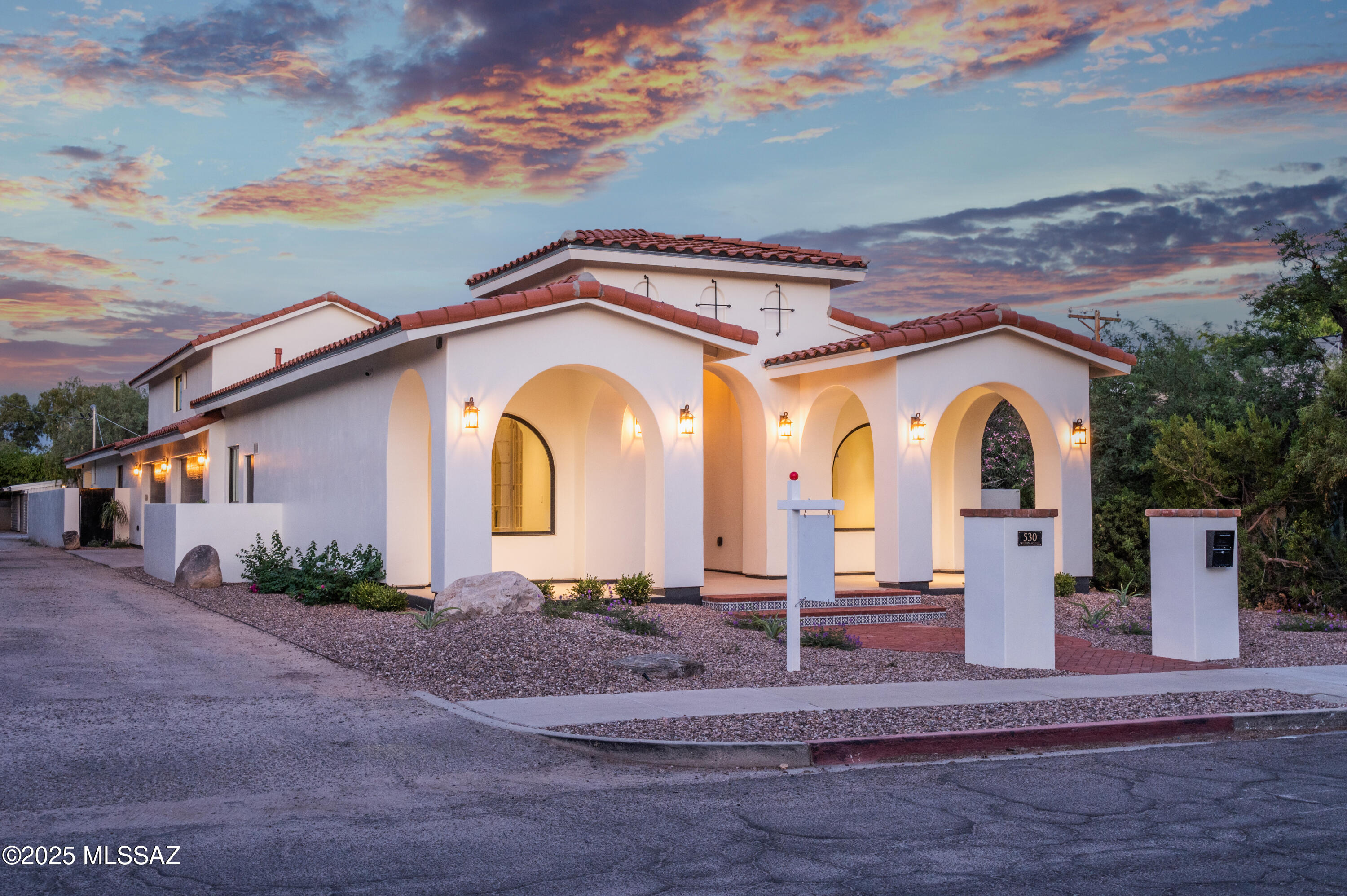 Beautiful brand new build in the historical Sam Hughes neighborhood. Spacious 4 bedroom, 4 1/2 bath home, featuring gorgeous master ensuite with spa like shower and bath, large walk in closet with washer/dryer hookup, and private porch to watch sunrise over the catalinas. The 4 car garage has car charging capability and plenty of room for toys and storage. No expense was spared on the finishings, marble countertops in bathrooms, Taj Mahal quartzite countertops in kitchen, upgraded appliances, custom fireplace finish, antique doors invite you into the front office, bamboo flooring throughout. The entire house is wired for surround sound. Walking distance to U of A, restaurants and just minutes drive or bike ride to downtown. You must see this thoughtfully designed gem for yourself!
