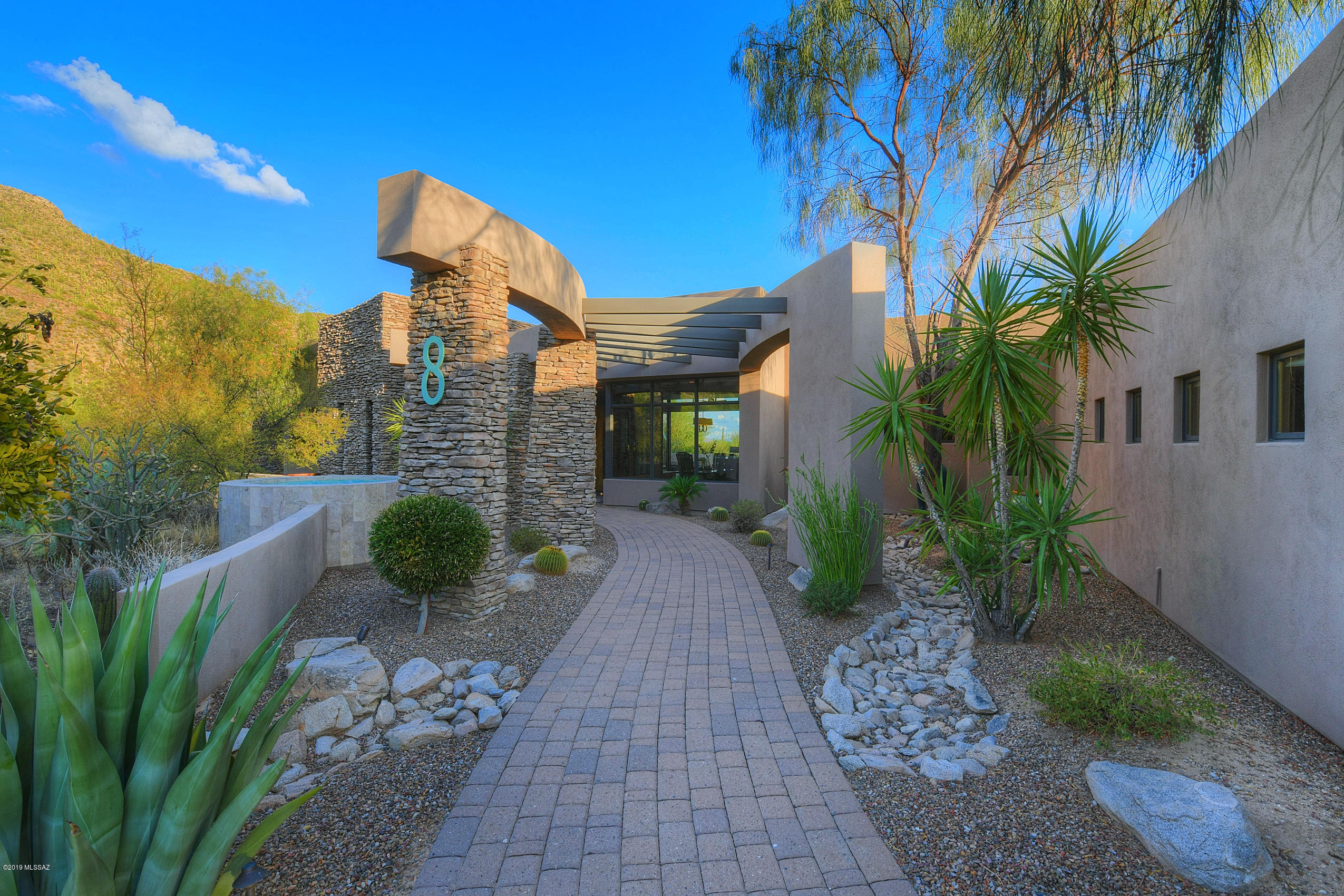 Peace, tranquility, elegance, and views. This spectacular private estate designed by M. Christensen has it all. This custom home boasts natural beauty and one of the most breath-taking views Canyon Pass has to offer. Carefully positioned, this home and its outdoor space allows for privacy or views wherever you look and provides the perfect spaces for entertaining or enjoying the serenity while having a glass of wine from the 200 bottle wine cellar. Private movie theater with wet bar, guest house, outdoor kitchen, salt -water infinity pool, firepit, and so much more! We look forward to seeing  you for a visit soon! Full Property Video available at https://youtu.be/vyK7uuAG3Lg