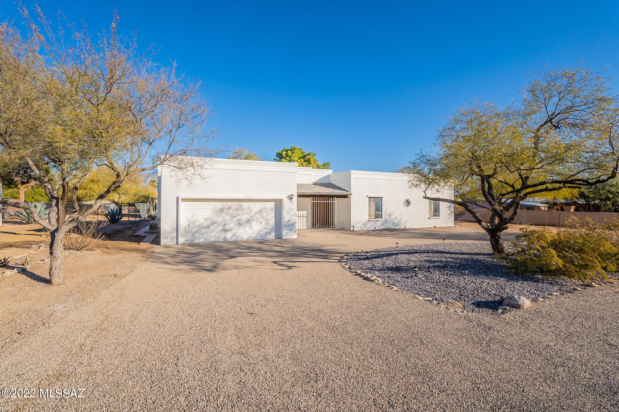 Custom block home on just under a half acre, NO HOA! Close proximity to major retailers and restaurants, walking distance to Udall Park. Newly remodeled with wood plank tile flooring, matching stainless steel Whirlpool Appliances, Quartz Countertops, Kitchen has pullouts and lots of cabinets. Dual Vanities in both bathrooms, Custom Master Shower, Ceiling fans in all of the spacious bedrooms.  Mountain views through from the Master Bedroom.  RV hookup and much more!