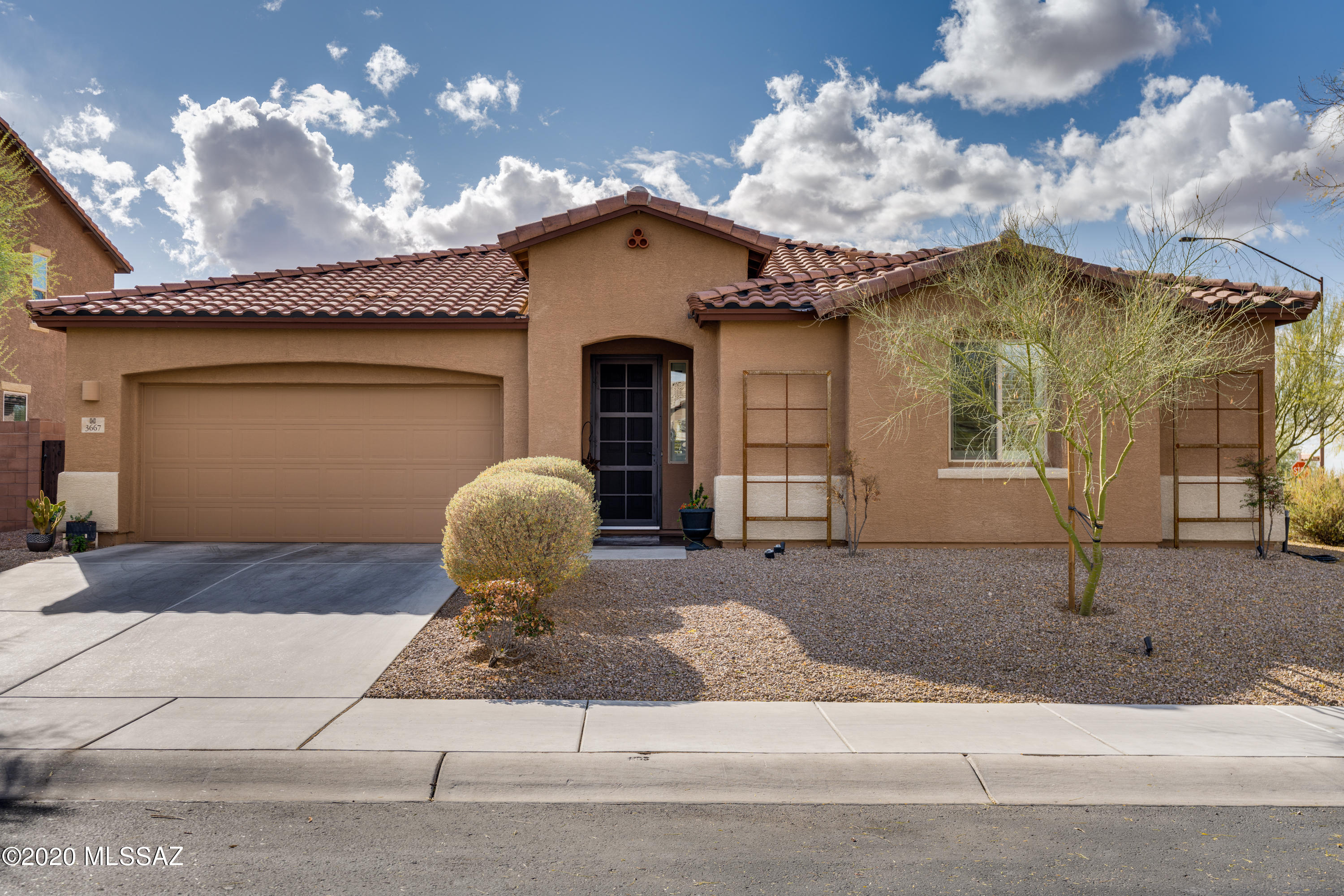 Immaculate, inviting family home with bright open floor plan. Split 3 bedroom plan with separate den/office, which could be easily converted to 4th bedroom. Gourmet kitchen boasts a large island, granite counters, tremendous cabinet & counter space, large separate pantry, gas stove, double oven & counter depth fridge. Master features large walk-in closet, dual sinks, shower & soaking tub. Additional features include 3 car tandem garage, plantation shutters, tile though out  main house & laundry room with sink. Outdoor living at its finest with resort style backyard the includes a covered patio, sparkling pool, professional landscaping & accent lighting. Fabulous gated neighborhood convenient to schools and shopping. Don't miss this opportunity.