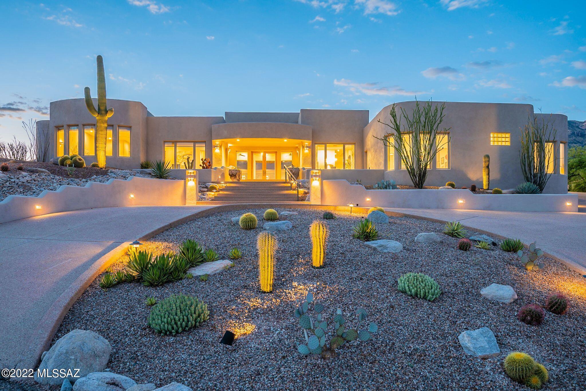 Dramatic southwest contemporary perched upon a hilltop in prestigious Alta Vista Estates featuring 360 degree views w/an unobstructed Catalina Mountain backdrop. Solid masonry construction, exposed beamed ceilings, stunning stacked stone fireplace, newer tile floors throughout. Pella windows, updated bathrooms. Spacious owner's suite w/2-way gas fireplace, luxurious walk-in shower, spa tub, 2 vanities. Presently configured as 3 bedrooms, workout room & office. Family room/den & guest rooms are split from owner's side. Elegant design w/gracious dining & dramatic open kitchen. 3 car garage w/storage plus a 1,307 sq ft garage/workshop & entertaining space w/HVAC & 1/2 bath. Guest quarters potential! Pebble-tec pool & spa, 2 outdoor BBQ/bar areas w/granite tops, fridges, fireplace & views!