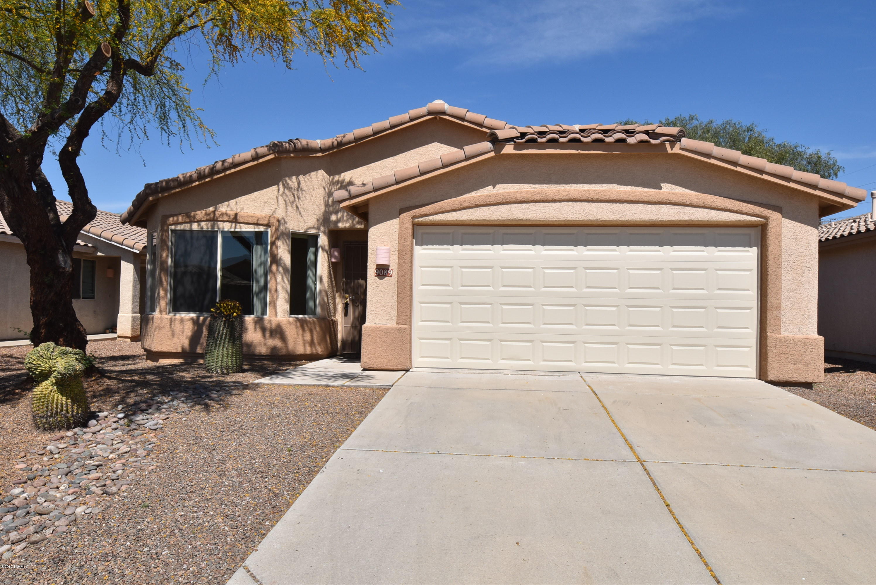 This home is not listed on Craigslist. If you see it there it is not a legitimate ad. Fantastic NW location in the Bluffs at LaCholla/Overton on cul-de-sac street. Ceramic tile everywhere but living rm & bedrooms. Front living rm with bay window & eat in kitchen open to the family rm. Master bedroom  bay window, walk in closet & double vanity sinks in the master bath. Ceiling fans in all the bedrooms and family room. Roll out shelves and side-by-side refrigerator in the kitchen. Great backyard with covered patio and mature trees. 2 car garage with storage cabinets and laundry sink. Washer/dryer included. Non-smoking home. One year lease minimum - longer term lease possible. $45 application fee per adult. Subject to credit approval. Renters insurance required. The owner has requested no pet