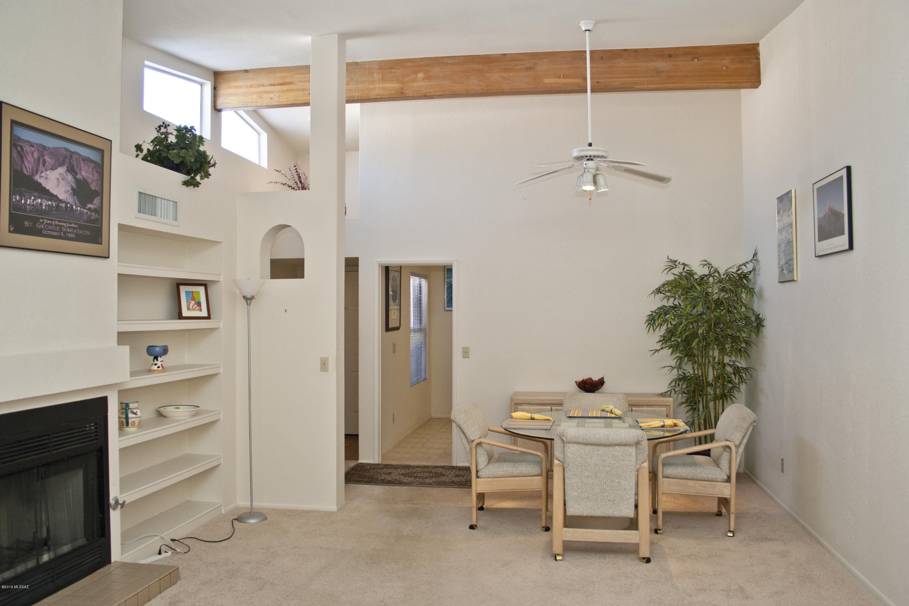 This spacious Wrightstown Square townhome features vaulted ceilings in the living areas and offers an attached 2-car garage. Enjoy peace of mind and cost savings knowing there are no poly pipes and no popcorn ceilings! The well-kept neighborhood includes a large pool and spa area with lush landscaping and an oversized ramada that features a full kitchen for gatherings. Located in close proximity to Udall Park and the Loop multi-use path for easy access to a variety of outdoor activities, you'll also appreciate the numerous options for shopping and dining nearby. This right sized property is among the most attractive around.
