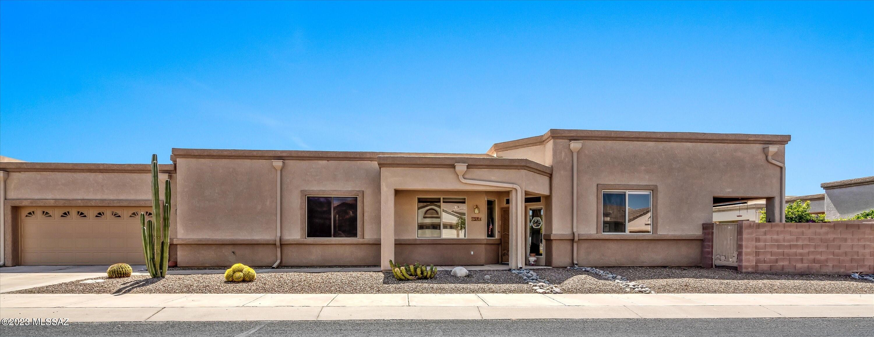 The larger of all models in The Cove is ready for you to move-in!  Light and bright, open concept, split bedroom 2 Bed 2 Bath with Den off of the primary and patio access! High ceilings and tiled throughout the home.  The skylights, north and west facing windows bring in so much natural light.  The HVAC and hot water heater are only 4 years old.  Seller has had the sewer lines and air ducts cleaned.  The covered patio is tiled and features a peaceful setting with mature orange tree.  The Cove offers so many amenities: golf, pickleball, bocce, tennis, wood shop, quilt club and so much more!