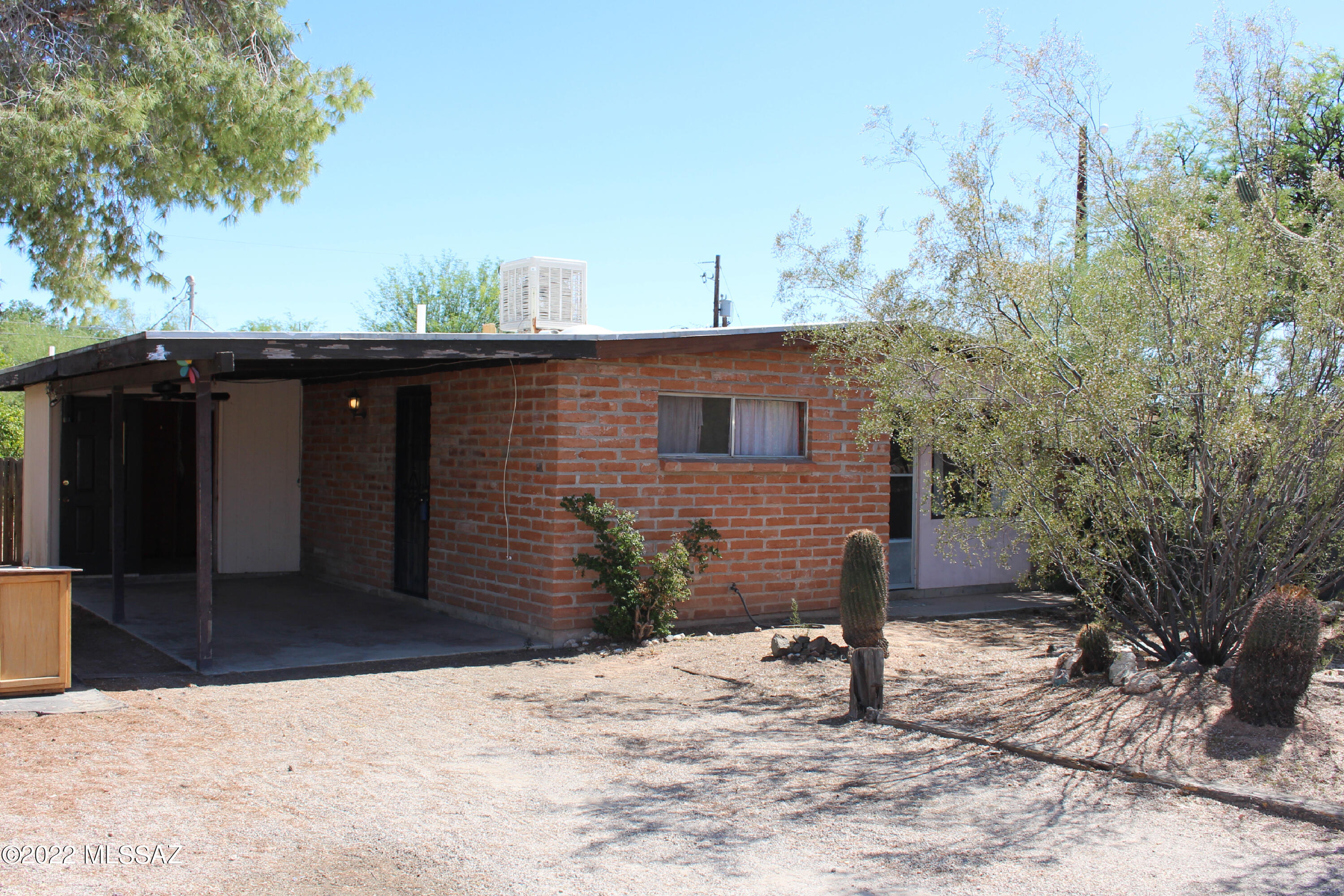 House needs to be renovated! Great for an investor or homeowner willing to put in some sweat equity. Bones are great on this 1982 built 823 SqFt  adobe brick home. The floor plan making it feel larger than it is with eat in kitchen, living room  & 2 bd/1 ba. The large backyard has a block wall completely enclosing it for privacy. Room to add a guest house on this large lot just need to check the zoning.  University of Arizona is only 4.1 miles away and only 1.7 miles to Interstate 10 simplifying your commute to work or day to day errands. No A/C. As-Is. Seller will review all offers late Friday.