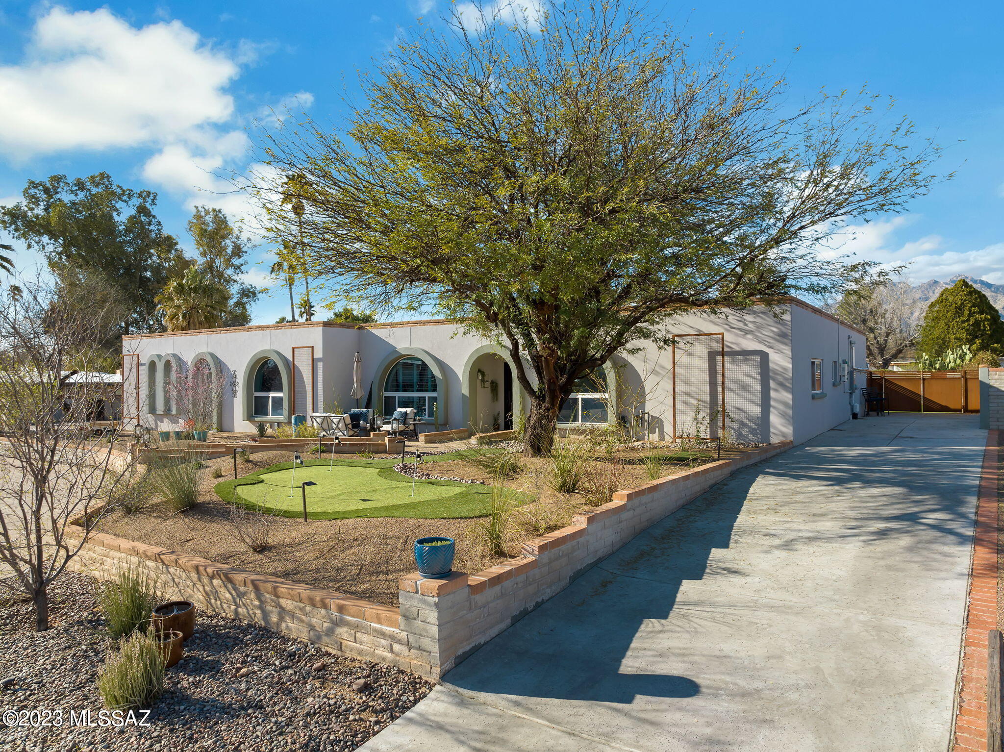 If you enjoy entertaining both inside and out, then be ready to be impressed.  This 5br/3ba home on Tucson's north side is ready to exceed your expectations.  Recently completely remodeled and expanded to a split floor plan with dual master suites, over 3100sqft, and luxury amenities around every corner.  Inside features a gourmet kitchen with accent lighting, oversized island, plenty of cabinet/storage space, formal dining area, and dual living rooms with double sided fireplace.  Out back the party continues whether you're sitting at the outdoor kitchen/bar, cooling off in the pool, warming up in the hot tub, or lounging around multiple seating areas with gas fire pits.  Don't fear your electric bill during the peak of the summer with your owned solar system.  This one is a must see!