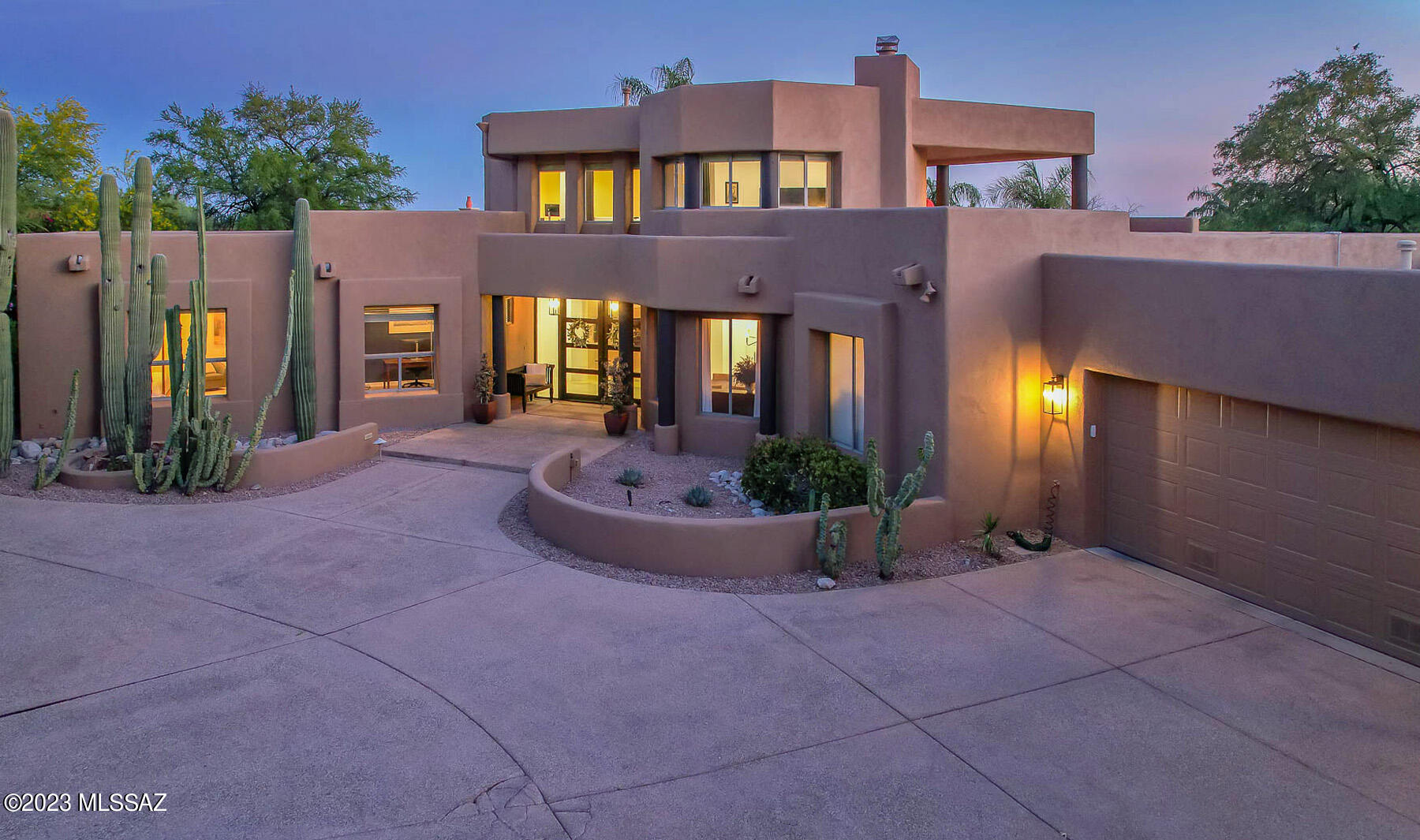 Discover luxury and elegance in the prestigious gated community of Ventana Canyon Country Club Estates. This stunning southwest contemporary home spans 3,919 sq. ft., featuring 3 generously-sized bedrooms, 3 full bathrooms, and a refined office with wood flooring, which has been thoughtfully enhanced.

As you enter this exceptional property, the custom metal and glass doors captivate with their artistic elegance. This striking entryway sets the stage for the luxurious living spaces within, boasting an open floor plan, soaring ceilings, and breathtaking mountain views. Carefully curated enhancements throughout the home create a perfect balance of style, comfort, and sophistication, ensuring an unparalleled living experience. At the heart of this home, you'll find the exquisitely renovated gourmet kitchen, showcasing a large Quartz island, high-end stainless steel appliances, and a built-in wine refrigerator. This culinary haven masterfully combines form and function, providing an extraordinary experience for the discerning home chef.

The loft/activity room, complete with a fireplace, leads to a covered patio showcasing panoramic vistas. The expansive master suite offers a haven of relaxation, with luxurious amenities and a sleek glass shower enclosure. The refreshed additional bedrooms ensure a comfortable living experience for family and guests.

Step into your private oasis in the backyard, featuring a sparkling pool, spa, and fireplace as well as a new travertine patio. The professionally landscaped grounds, including an orchard with multiple fruit trees, are illuminated by upgraded LED landscape lighting, creating a serene retreat.

Boasting numerous recent upgrades, this exceptional property offers unmatched luxury and sophistication for the discerning buyer.
