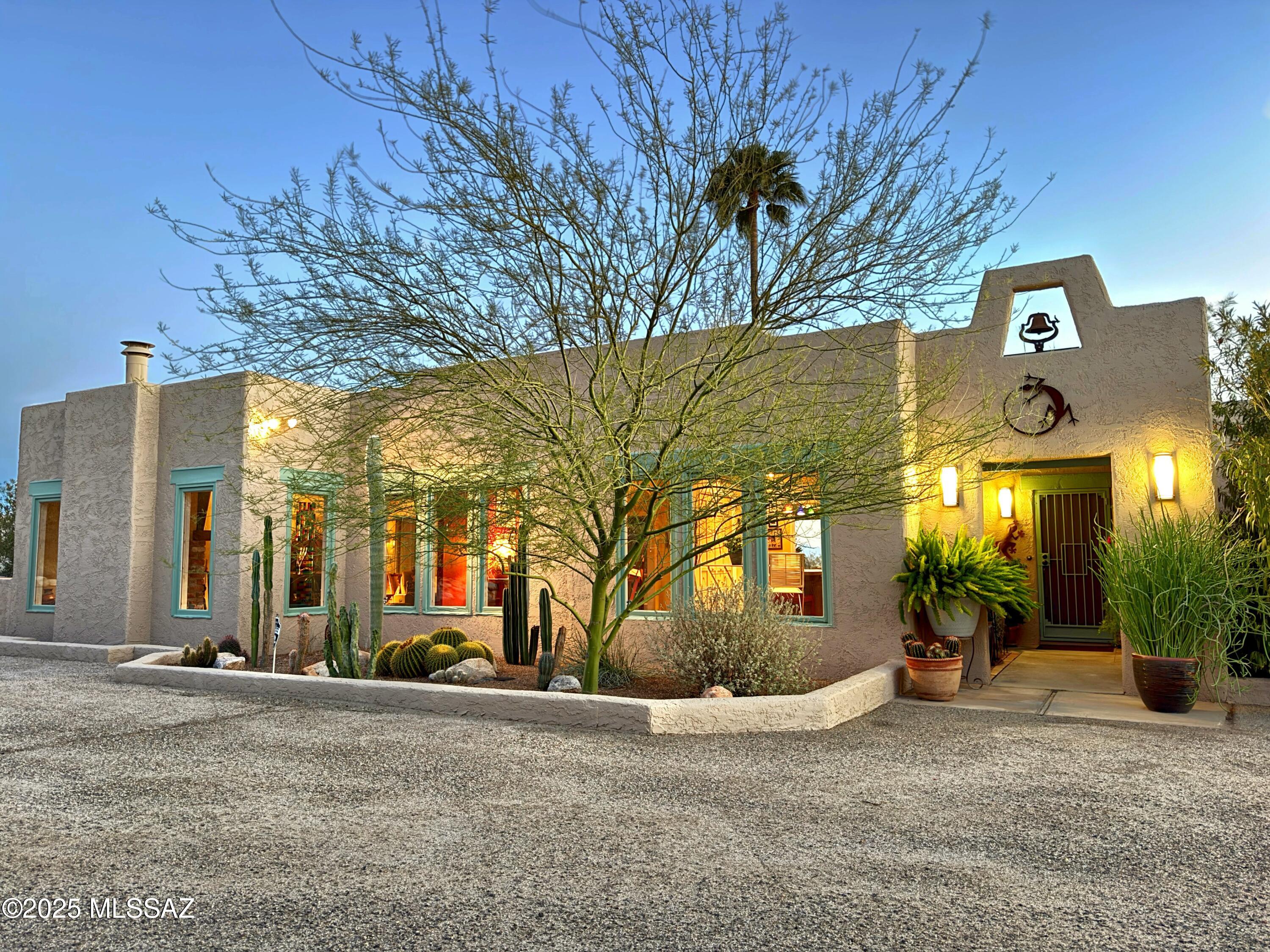 Range Priced Listing.  Sellers will consider or counter offers between $819,900-$849,900.  Nestled at the top of a quiet cul-de-sac, this exquisite custom home offers spectacular 180-degree views of Tucson's city lights and the majestic Catalina Mountains!  Set with a highly desirable North/South orientation within a sought-after neighborhood, this home exudes quality, charm, and uniqueness. With beautiful stained concrete floors throughout, this meticulously cared-for residence radiates warmth and character. The formal living and dining rooms feature soaring 10' beamed ceilings, perfectly framing the breathtaking views. Every window provides a unique perspective, showcasing marvelous vistas of both the city and mountains.  See More... Enjoy peaceful evenings on the tranquil patio overlooking the city, or sip your morning coffee on the private north-facing patio where you can take in stunning mountain views. The landscape is enhanced by an array of spectacular plants, adding to the serene outdoor ambiance.  With plenty of possibilities for expansion, this home offers room to grow, providing the opportunity to add a third bedroom suite and even build a garage, all while preserving the awe-inspiring scenery. Currently offering 2 bedrooms, it strikes a perfect balance of comfort and potential. Located just a short walk from La Encantada, where upscale shopping, dining, and entertainment await, this home offers the perfect blend of peaceful seclusion and city convenience. This is an exceptional opportunity to own a home that has been lovingly maintained by its owners for 31 yearsa true must-see to fully appreciate its beauty and potential.