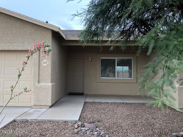 This beautiful home is located in a big private corner lot with front landscaping. It features an open floor plan, kitchen has cherry cabinets and newer stainless steel appliances. Roof only 2 years old with 30 year warranty!!! Wow! New exterior paint, alarm system, security camera system with phone access, and great mountain views from the back patio. No back neighbors just land and views! A must see!