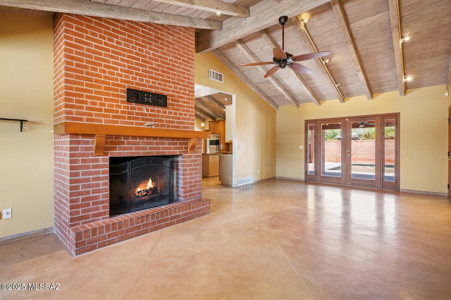 Pride of ownership shines in this classic Burnt Adobe Ranch in the Historic Harold Bell Wright Estates. This 4BD/3BA , 2,830 SF home blends vintage charm with modern updates. Exposed wood beam ceilings span the main living areas and spacious Primary Suite. A chef's kitchen opens to inviting living spaces, while the spa-like Primary bath offers a tranquil retreat. Enjoy a resort-style backyard with pool, expansive patios, outdoor kitchen, fireplace, mature vegetation and lush lawn. A versatile floorpan with second primary & add'l flex room off the Primary is ideal for an office or playroom. Bonus 250 SF storage room/workshop has ADU potential. New roof (Mar '25). Reduced historic tax rate for owner-occupants.