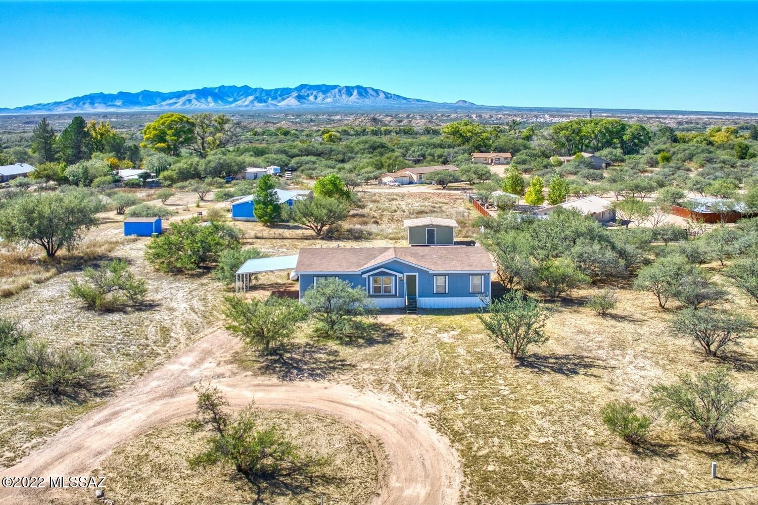 Under contract - ACCEPTING BACKUP OFFERS AND SHOWINGS. 1.3 acres. Tranquil beautiful Mountain views to east and west. 30 Min away from Tucson and Sierra Vista! Great neighbors!3 bed/2 full bath split floor plan. Large master bath with garden tub and separate shower. Two separate living areas with built in entertainment center. Large laundry room & walk in pantry. Huge master bedroom with large master bath. Large master bathroom. Very open, bright and airy. Fenced back yard. 20x16 shed. Double Carport, ceiling fans, Dual-pane windows. Covered Back porch. New carpeting. Built-ins, recently painted inside and out. Lots of mature mesquite trees, Full RV hookup!
Cable ready, high-speed internet (without a monthly cap! Home Shield Home Warranty.