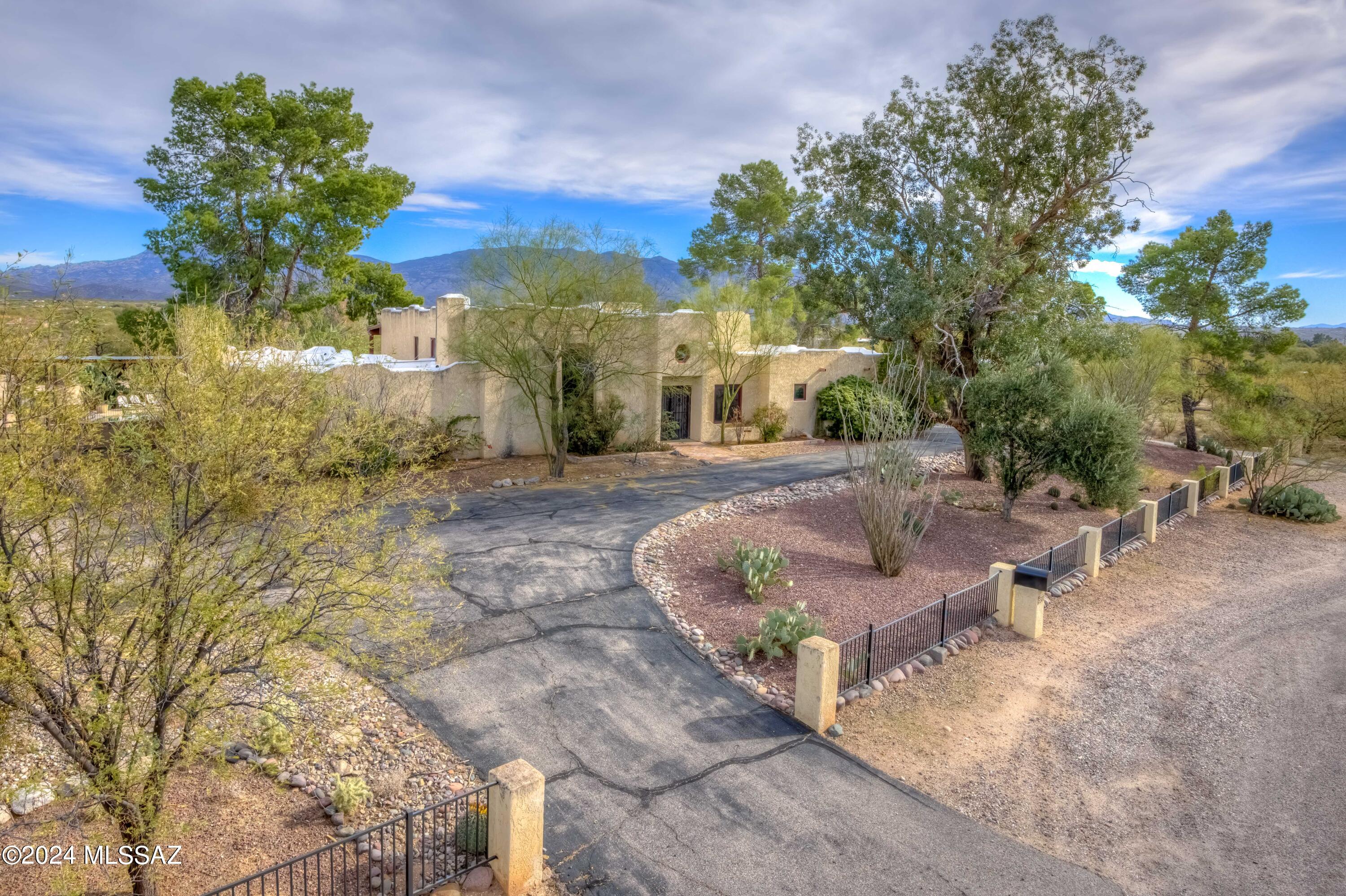 Stunning views from every side of this property! This hilltop, spacious 7-bed, 3.41-acre property in Tanque Verde valley features 4675 sq ft in the main house and a 988 sq ft 2-bed guest house: This horse property borders the Agua Caliente wash and has plenty of room for horse facilities. Check the comps and you'll see this is a tremendous fix-up opportunity for instant equity. Nestled on a cul-de-sac with access to endless trails and peace and quiet is priceless. Two car attached garage AND RV carport on North side of home. Don't miss out!