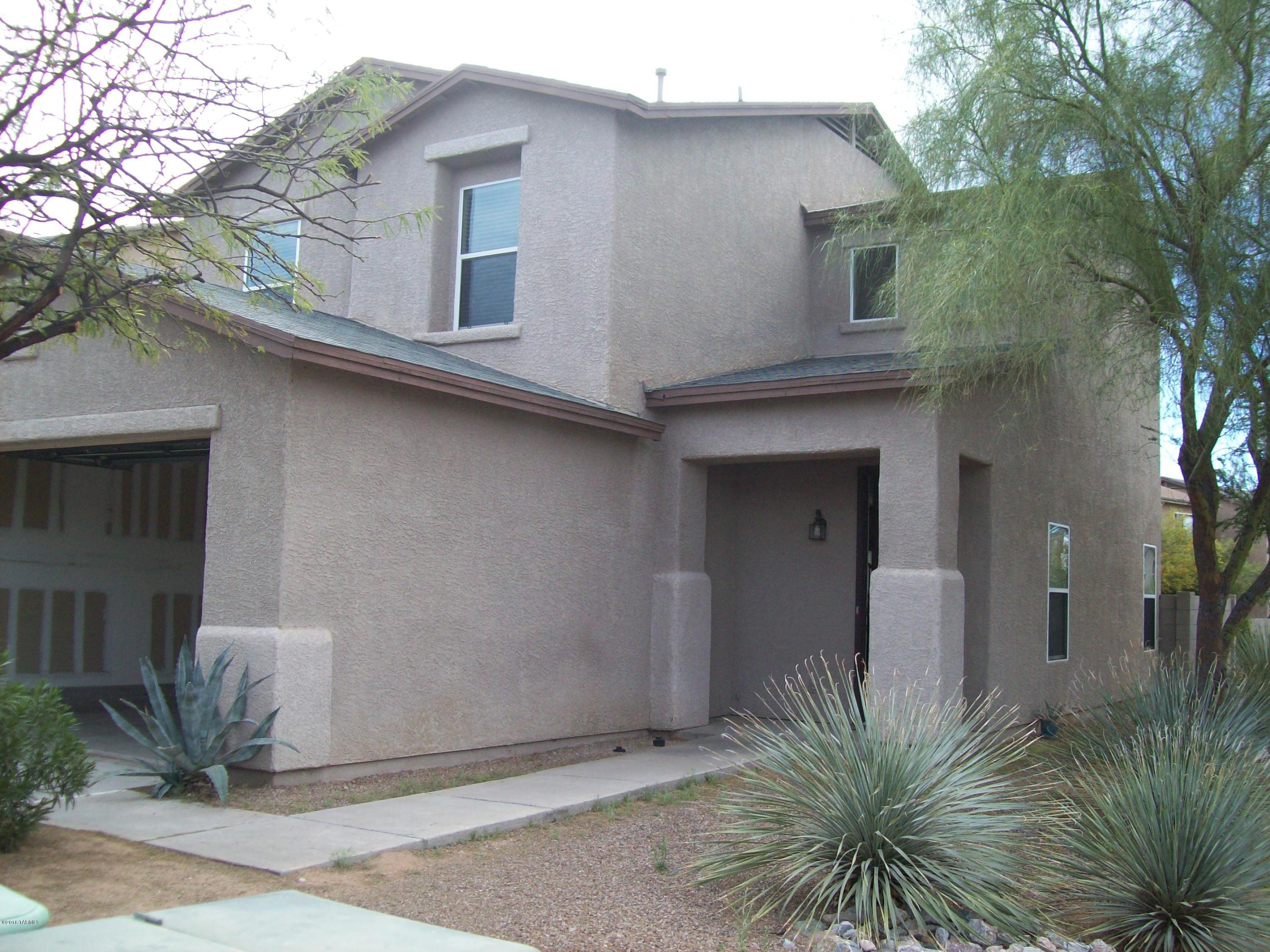 This 1627 sq ft, 3bd 2.5ba, 2 story home is waiting for you. Home has open kitchen, covered patio and no neighbors behind and open wash to one side. Close to Schools, Shopping, and Omni Tucson National Golf Course and Resort.Rent is 1050, Deposit 1050, Credit Check 50, Pet fee 250. Call Jennifer for a viewing.
