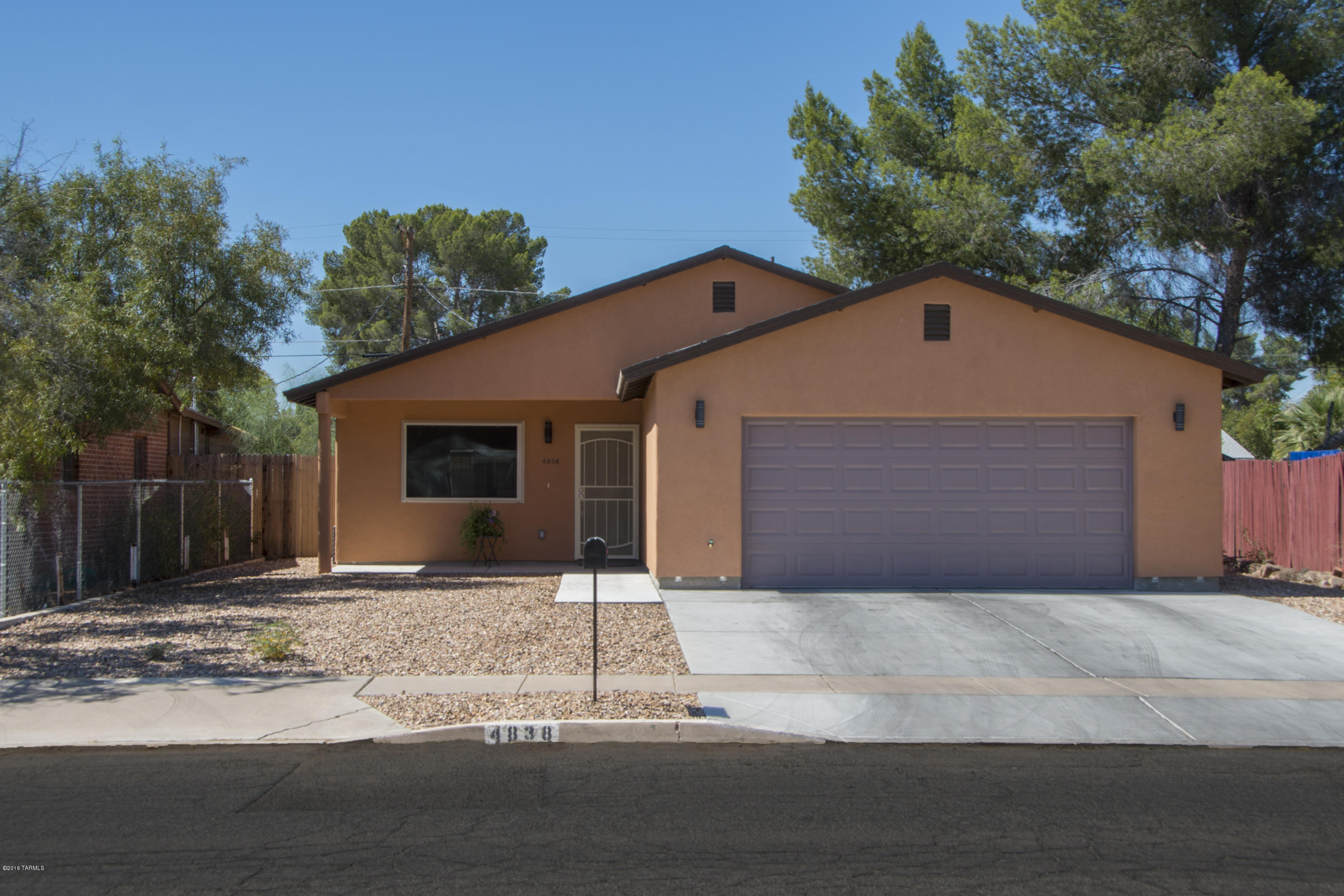 Newer (2014) built home in great close in location, near shopping, schools, bus line and TMC. This darling home has porcelain tile in high traffic areas, Nice kitchen with granite counters, gas range, Microwave and dw. The master suite has a walk in shower. Backyard with large covered ramada. Make this lovely home yours today!