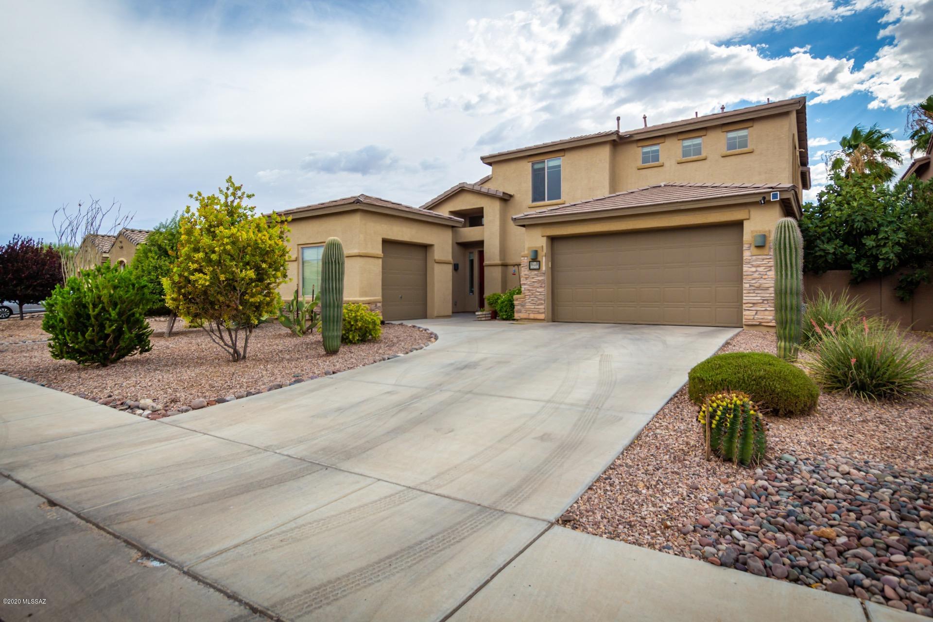 Gorgeous home w/great curb appeal in the desirable Community of Ironwood Reserve.  Spacious open floor plan, fireplace, soaring ceilings, formal living/dining room, ceiling fans, & beautiful tiled floors. Center kitchen island, handsome granite counters, breakfast bar, SS appliances, pantry, & upgraded wood cabinets w/crown moulding. French door to patio from breakfast area. Master retreat on first level w/stunning wood floors, private en suite w/dual sinks, & walk-in closet. Fantastic loft area w/endless possibilities, wood floors also on 2nd level, ample closets, generous sized bedrooms, & 2.5 baths. Large laundry w/utility sink & storage cabinets. Serene backyard setting offers a covered patio, pavered patio for entertaining, meticulous desert landscape, & built-in BBQ.