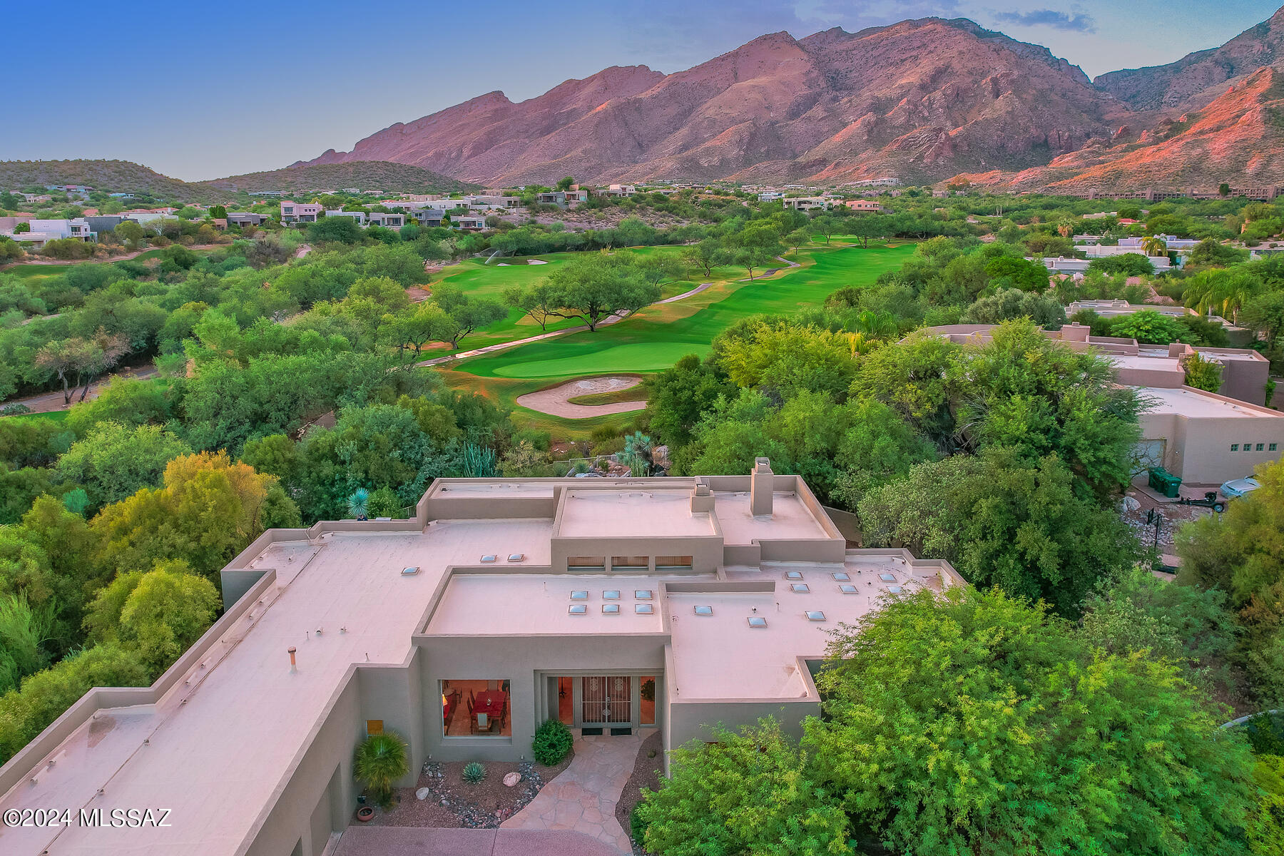 Stunning Southwest Contemporary nestled on a cul-de-sac on the 11th green of the Ventana Canyon course. Enjoy picture-perfect Catalina & Rincon mountain views from the resort-like back yard featuring heated pool & spa, oversized flagstone patio & blt-in BBQ island. Spacious split 4BR/3BA floor plan boasts a gigantic great room, travertine floors, soaring ceilings and walls of windows.  Open kitchen with eating area, lrg island & granite counters. Over-sized primary suite has sep sitting area, dual sided fireplace, jetted tub, sep walk in shower and 2 huge walk-in closets. Oversized 3-bay garage. New interior and exterior paint. Outstanding location with North/South orientation and back yard facing golf course. Guard gated. Views and Privacy! Owner/Agent.