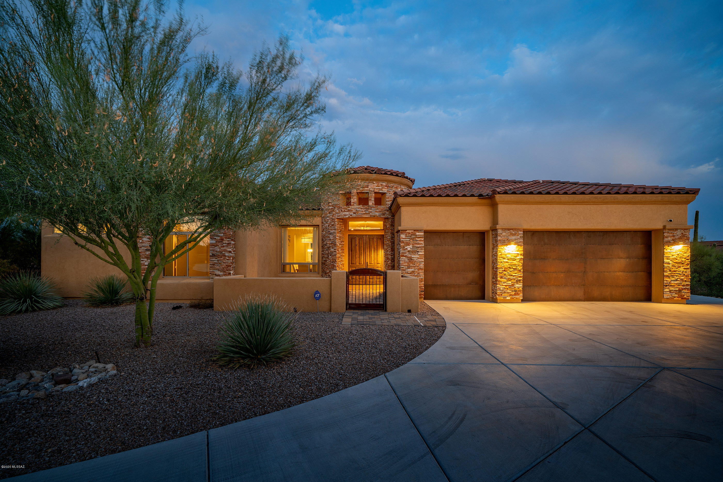 Nestled within the prestigious gated community of Tortolita Vistas offering an oasis of serenity, luxury and unwavering attention to detail. This stunning AF Sterling home possesses a refined fit and finish level felt immediately upon entering the home. Take notice of the dramatic ceiling heights, allowing natural light to filter through an array of large picture windows, framing the Catalina Mountains beyond. Move past the foyer to find the grand scale living, dining and family rooms opening onto the gourmet chef's kitchen, featuring top end stainless steel appliances, custom knotty alder cabinetry, granite countertops and a high quality continuity of millwork carried throughout the residence. The layout lends itself to entertaining family and friends alike, offering a split bedroom concept, with the master suite sequestered on the Southeast end of the property, captivating it's audience with large walk-in dual closets, luxurious bath and windows from the bedroom spilling out over a private backyard. The outdoor spaces organize and focus around the Catalina Mountain range, as they form a series of spatial engagements, which include a large covered patio, sun drenched pool and large area of synthetic turf with putting green, all there for your personal enjoyment on this premium homesite.