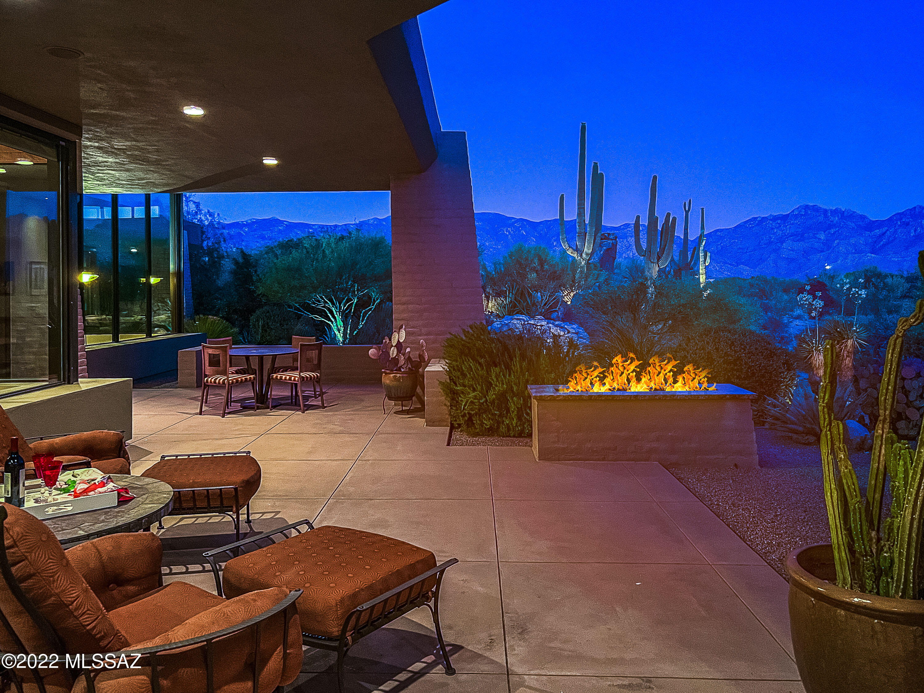 Magical, serene AZ resort lifestyle! Striking Kevin Howard-designed contemporary with Frank Lloyd Wright flair on double lot with rock outcroppings, saguaro and panoramic Catalina views! Great room with soaring maple inset ceiling & high windows to capture scenic views. Sandstone floors, 2 suites, office/3rd BR, 3 BA, gourmet kitchen, 300-bottle wine ref, 8' maple doors, 3 Fpls, rock waterfall, BBQ, covered lounge, roof deck, rolling screens, owned solar, oversized 3-car garage w/hot/cold water valve for car washing! Double lot assures privacy & forever views (all around is built). Oro Valley location in guard-gated Estates at Honey Bee Ridge by championship Stone Canyon Golf Club and near shopping, restaurants & hiking/biking trails. You'll love the exquisite Zen-like private setting!