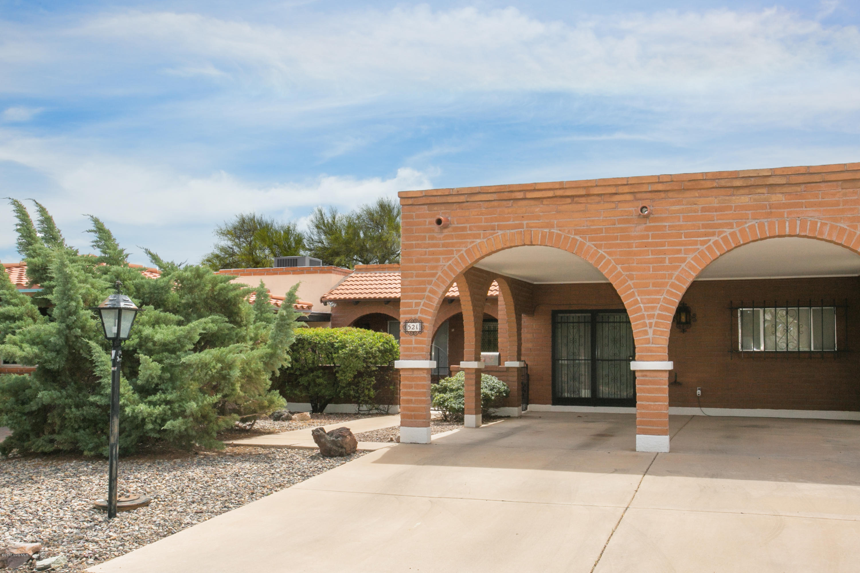 Breathtaking panoramic views of the Santa Rita mountains. Townhouse IV features acres of common land and lush vegetation. Bright freshly painted 3BD/2BA home with new carpet, and 1958 sqft of living space. Formal dining, great room with gas fireplace and skylights. 2 car carport, electric black-out shutters, sun/Arizona room. Close to shopping, rec center, and walking trails. Come and enjoy the lifestyle that Green Valley offers. Call today for your private showing.