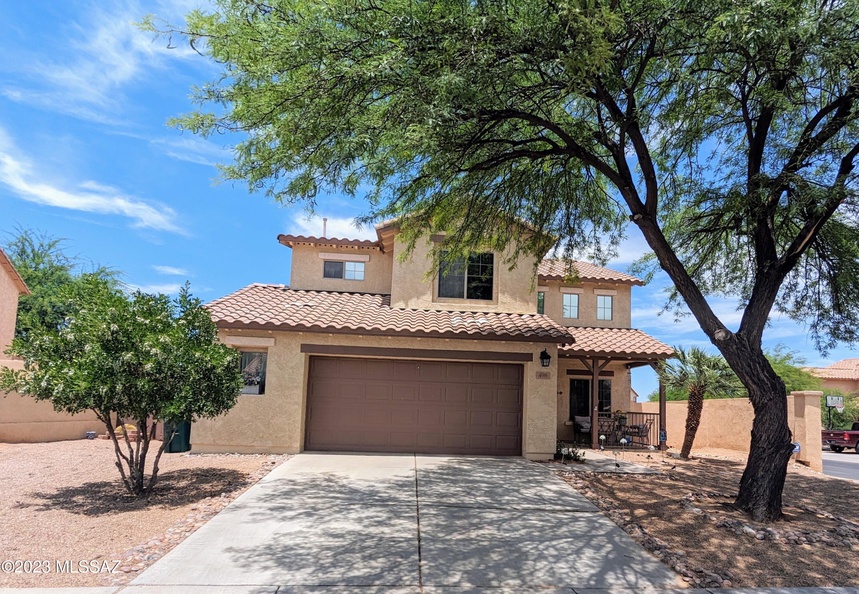 Looking for 5 bedrooms? This place it gorgeous! Sitting on a large corner lot, w/ mountain views from the master balcony. Vaulted ceilings w/ celestial windows, and upgraded maple cabinetry throughout. The beautiful kitchen has tons of cabinets w/ pull-outs, granite countertops, a large island, and a Kohler double sink. Two living spaces, ceiling fans in all bedrooms, and family room. Nice sized yard w/ double gates, gas hook-up, an extra large side yard, an extended covered patio w/ ceiling fans, raised garden, and fruit trees. Perfectly located, in the Entrada Bonita gated community of Rancho Sahuarita. Walking distance to pools, parks, Anza Trail School, the clubhouse and shopping.