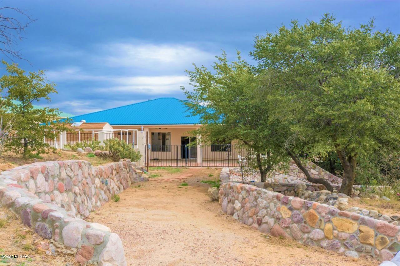 Feel like you're on Top of the World! This Beautiful Hilltop Property in Oracle is out of a storybook. Charming 1 Story 1,867 sq. ft home with 3 BR / 2 BA is nestled in a natural paradise of Winding Stone Pathways with Panoramic Views, Lush Rolling Landscape and a variety of Trees. Your Top Quality home Features an Open Floorplan w/ Gourmet Kitchen, Granite Counter tops, Stainless Appliances & Breakfast Bar that is open to Large Family Room w/ Cozy Gas Fireplace and Slider to Serene Covered Rear Patio over- looking your 1.82 Acres of Natural Beauty. Enjoy both a She Shed & He Shed! This home has desirable Split-Bedroom Floorplan w/ Concrete Flooring throughout, Front Room can be used as Dining Room, Living Room or Office also a wonderful 2 Car Garage & Large Parking Area for guests. Enjoy!