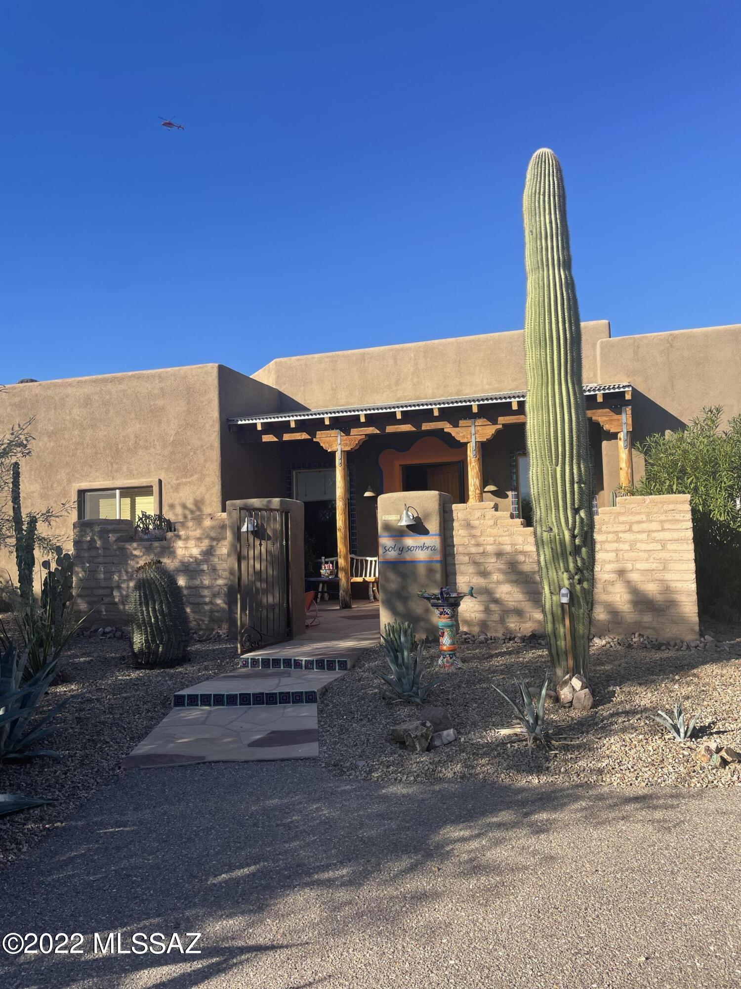 Charming Southwest find sitting on over 1.5 acres of lush desert! Remarkable construction design with walls of 10.5'' thick R40 rating. Energy efficient, tastefully painted, pool with mountain views, water softener, over 30ft garage, gourmet kitchen for your inner chef, and plenty of room to entertain.