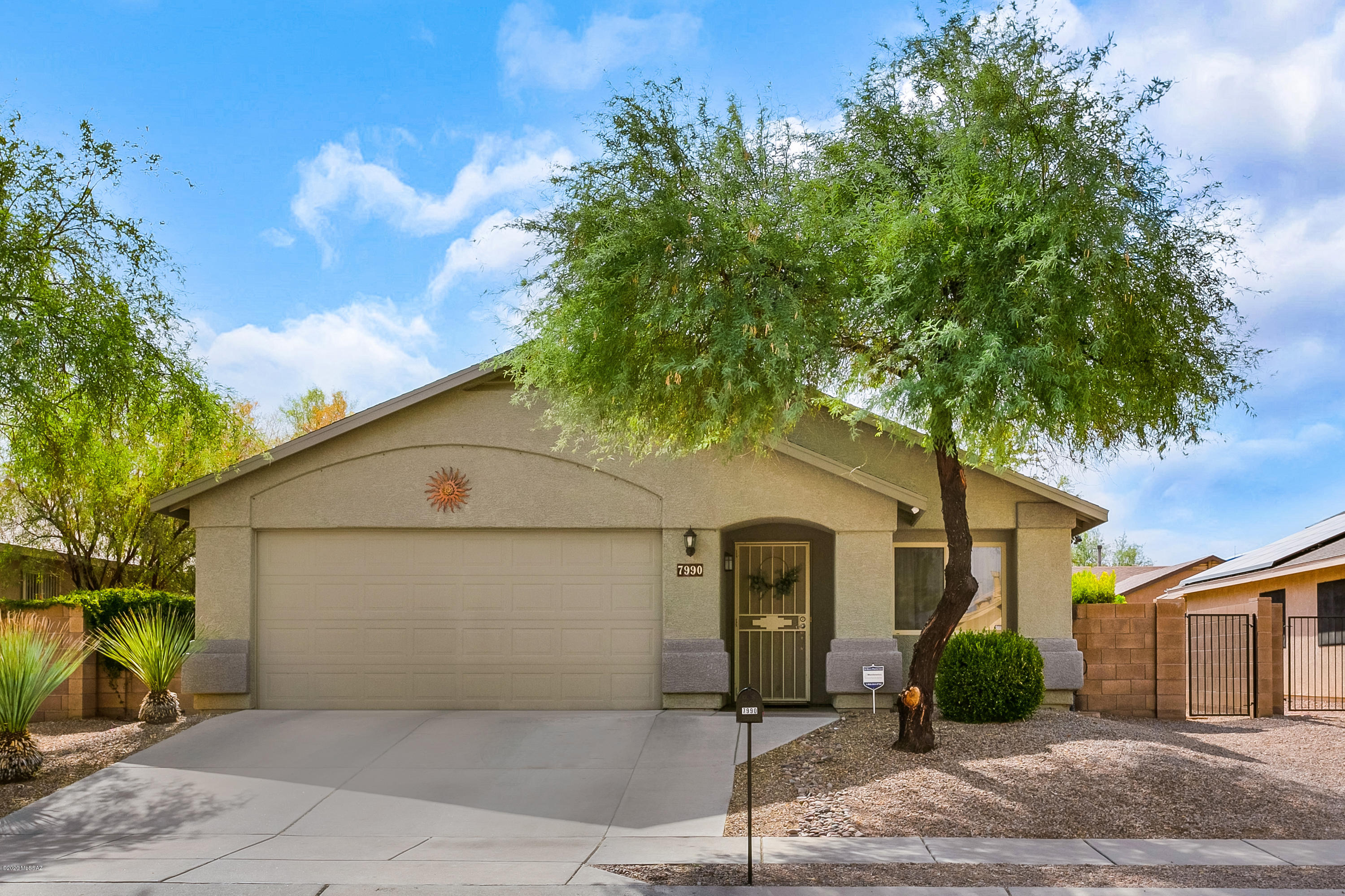 Original Owners! Beautiful property in East Tucson featuring 3 bedrooms, 2 bathrooms, two living areas and two dining areas. Lots of updates to include ceramic tile throughout with engineered wood in bedrooms. New water heater 2019. New roof 2017. Kitchen has new gray quartz counter tops with single basin under-mount sink, refinished kitchen cabinets with hardware, new faucet and microwave. Dual cabinet buffet added for additional kitchen storage. The bathrooms feature new toilets, sinks, faucets & light fixtures. Ceiling fans throughout. Built-in cabinets line two walls in the garage w/ designated freezer outlet. Entire property on drip irrigation w/ timer. Lush landscaping with grass, shrubs, raised flower beds and mature trees. Dog run, extended patio. Sellers Licensed Realtors in AZ
