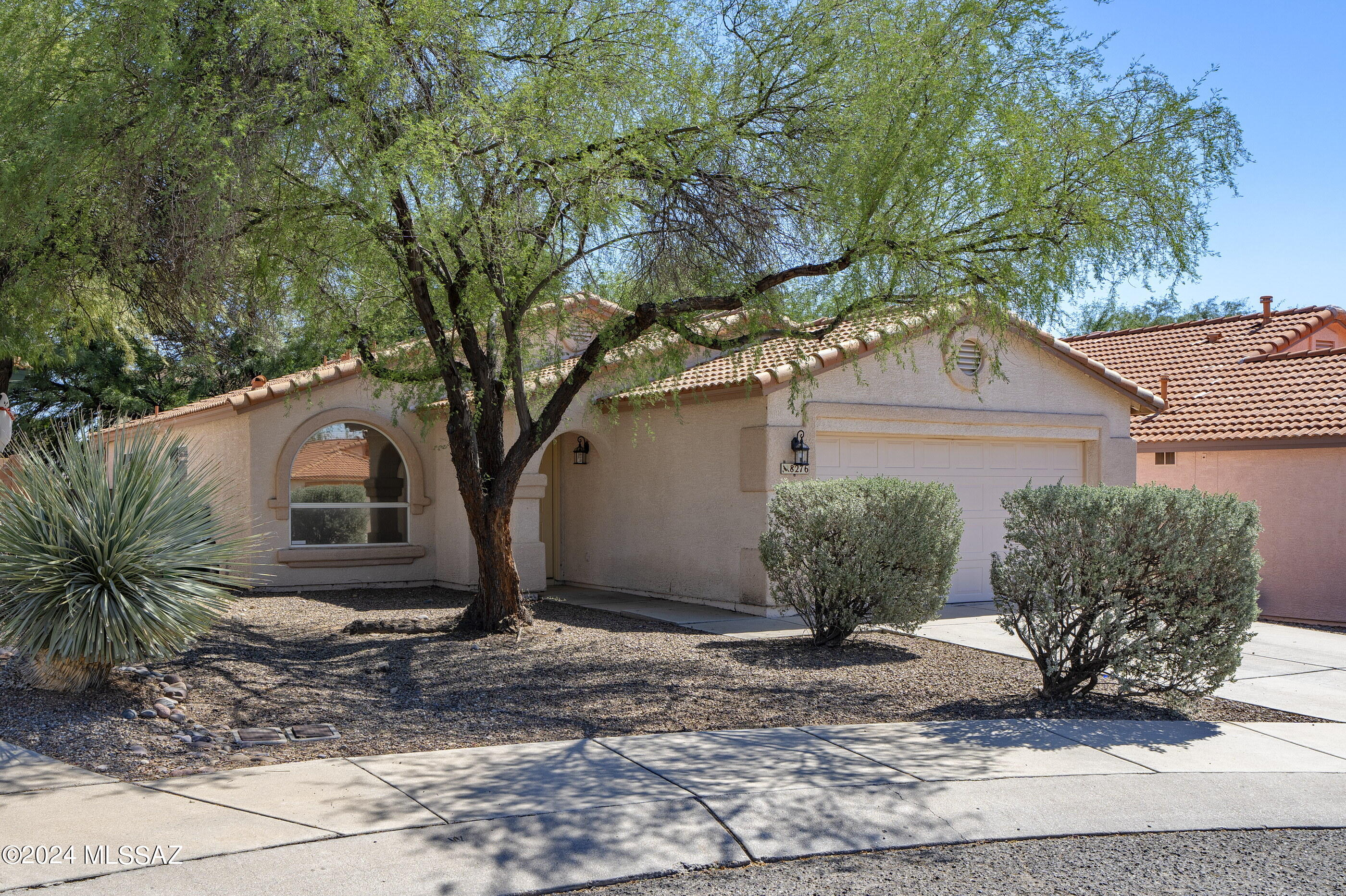 This three bedroom, two bath, one-story home lives in a pretty neighborhood with lots of trees! Located close to the world-famous Tucson Omni National Golf Club & Resort, the Northwest YMCA and the soon to be reimagined Foothills Mall, this 1414 square foot property would also make a great snowbird property or rental. No carpet in this home—just easy-care ceramic tile and wood-look vinyl throughout. A large living space has room for a dining table. The eat-in kitchen offers all appliances, lots of natural light and has access to the outdoor space.  The primary suite with two walk-in closets and attached full bath has a ceiling fan and overlooks the backyard. Two additional bedrooms are serviced by a full hall bath. Private fully fenced outdoor space has a covered patio and buffer space t the rear neighbor. Corporate seller, please allow 72 hours response. Offers submitted on the weekend will be presented on Monday.