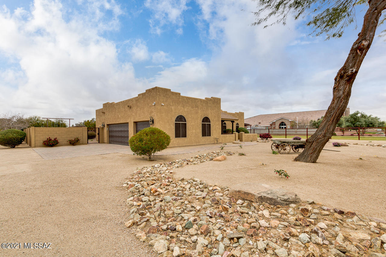 IRRIGATED horse property on 5.34 acres in highly sought-after neighborhood w/ HOA. Equestrian amenities feature a 300x155 arena w professional footing, lights, round pen, covered hay barn, trailer storage w/ RV hook-ups, & welder outlet. The barn features 20x20 6 stalls w/ auto waters, new fans, lights, insulated tack room, raised alley roof for ventilation, hot water for horse bathing, pavers t/o & a new guest studio apartment in the barn (2020)! Two large irrigated pastures w/ ample Bermuda! Gourmet eat-in kitchen features custom cabinets, backsplash, & large island. Granite t/o the home, office nook, & OWNED 8.7 KW solar panels! Other features include 2 fireplaces, groomed landscaping, driveway lined w/ trees, NEW TRANE AC unit, high pressure fog/mist system, pool & garden beds.