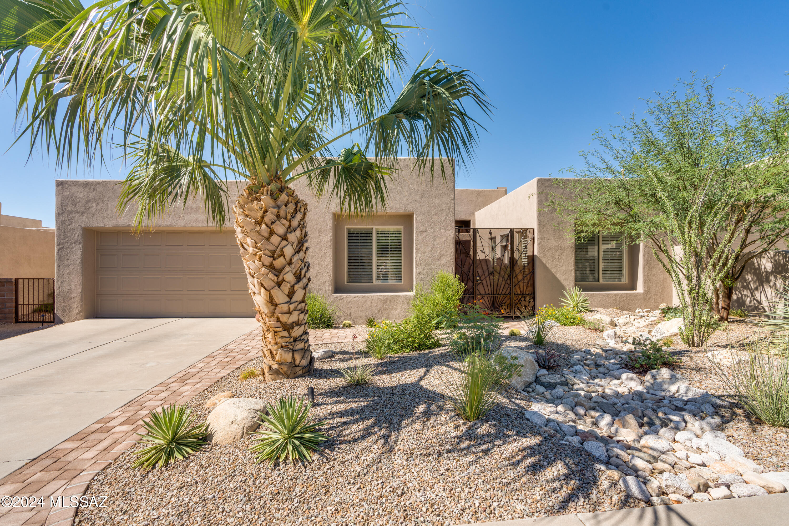 Step into stylish luxury in this impeccably remodeled and maintained foothills masterpiece!
Gated courtyard entry, past casita to the custom iron security door. Full wall windows open to sweeping city and valley views from inside and out. Travertine tile & engineered wood flooring, high ceilings, remote control window shades and custom blinds/shutters throughout. Remodeled kitchen features granite and quartz, top line appliances and fixtures. Spacious primary suite w soaking tub, large separate shower, 2 walk in closets. Casita is perfect for guests or studio with private entry and own bath. Covered paver patio, water feature, drip system, low care. Backs to common area providing unobstructed AMAZING views! Newer HVAC and more. See attached list. A must see property!