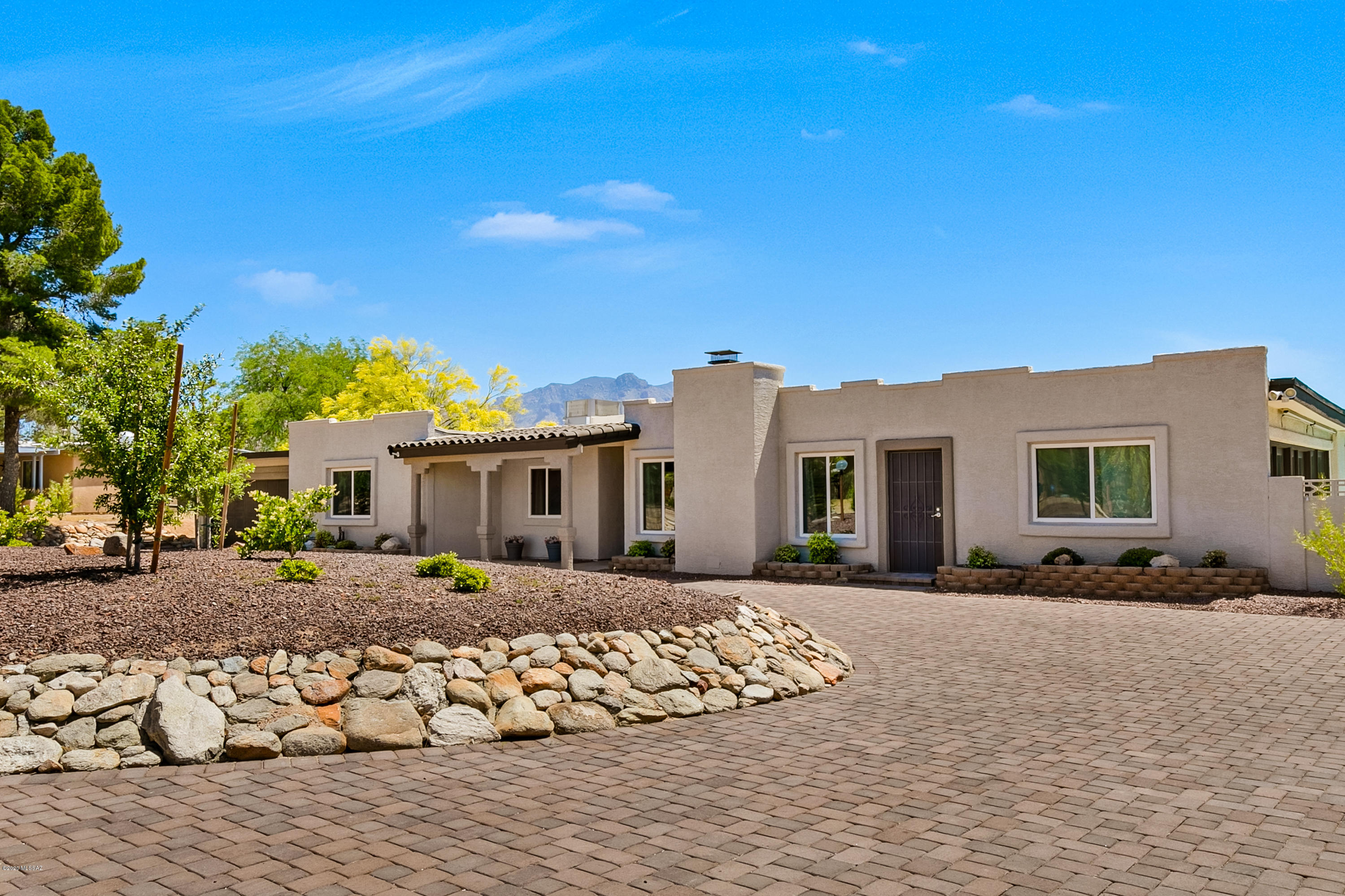 Wonderful Casas Adobes neighborhood and home! Private cul-de-sac lot, with Mountain views outback. Lovely curb appeal featuring expansive circular driveway with newly installed pavers. No HOA. Tastefully remodeled kitchen and baths, new tile flooring, newer exterior/interior paint. Covered back patio and sparkling side-yard pool for desert southwest entertaining & enjoyment! Tandem Garage can fit 4 cars, or use space for extra storage/workshop. New pool pump & AC compressor. Newer 2018 water filter and softer in garage, new irrigation. Leased solar electric system & owned solar pool heating. Excellent Northwest Tucson location in Oracle Heights, close to NW Hospital, Oracle Road, shopping, restaurants, hiking, and 5 minute freeway access. Well maintained & well priced home! See today