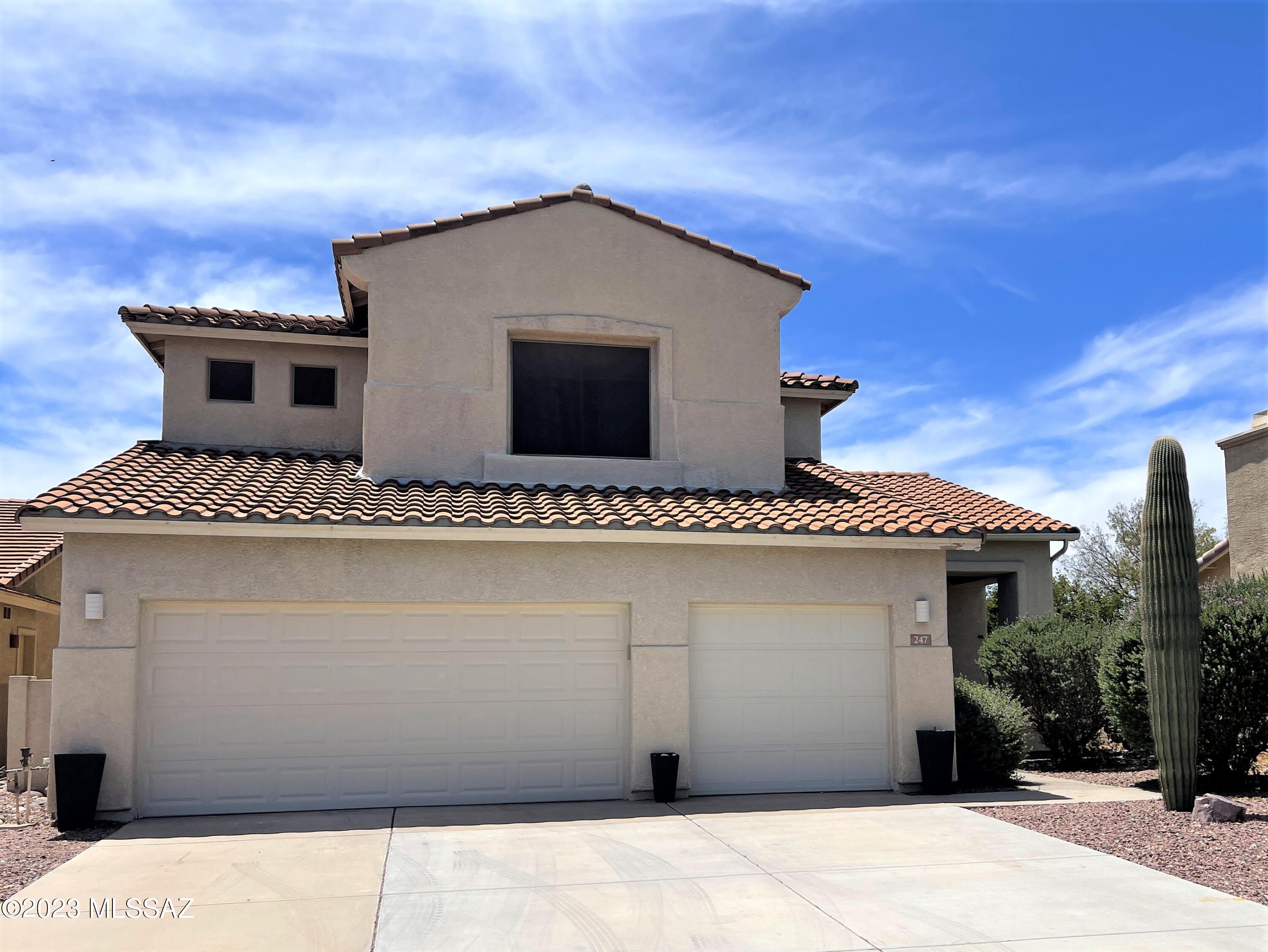 No Application Fees!  Beautiful 5 bedroom, 3 bathroom Oro Valley home located in Rancho Vistoso. This spacious and open floor plan home is a rare find and has many upgrades including large family room with 15 foot ceilings, separate formal dining room, and open living room with gas fireplace. Beautiful kitchen with granite countertops, upgraded hardware, subway tile backsplash, large island, separate pantry, backyard views, ceramic top electric range, stove top microwave, dishwasher and refrigerator. Oversize primary suite with extended mountain views, large walk-in closet, extended vanity, garden bath tub and separate shower. Three other additional bedrooms are located on the second floor with one full bedroom and full bathroom located on the first floor. Large laundry room with utility sink and cabinets along with washing machine and dryer. Three car garage offers plenty of parking and storage. Entertainer's backyard with sparkling pool, attached spa with waterfall mountain views, covered patio and extended cool decking around the pool.  No nearby neighbor to the rear with unobstructed mountain views.