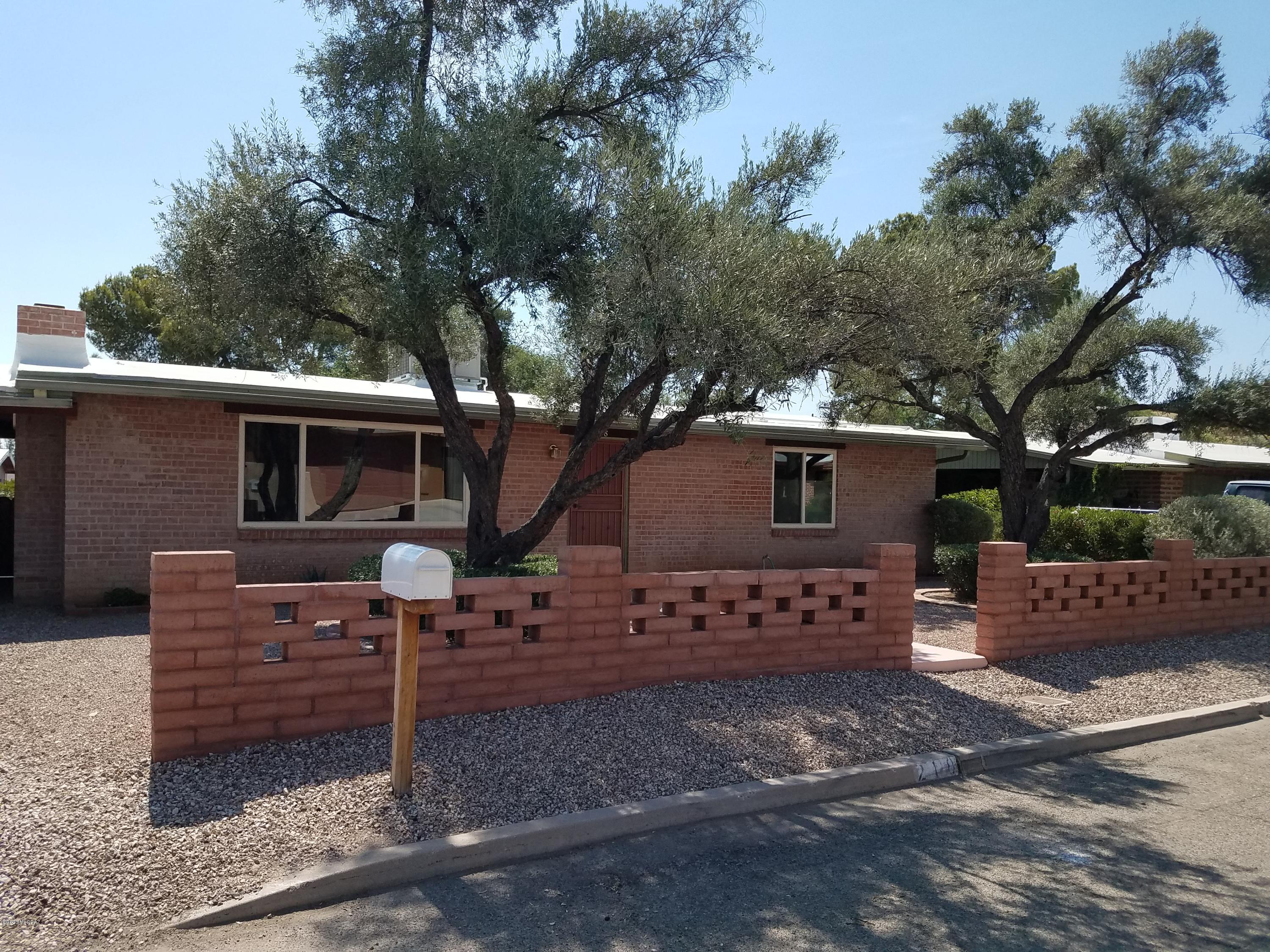 Fabulous light and creative energy flow in this small home with a big yard. Remodeled carefully over time, walls removed, every surface perfected, bamboo floors throughout, hot water heaters and a/c replaced, windows replaced, cabinets and counters replaced, bathroom fixtures replaced and shower tiled, large storage shed built in backyard.  Remarkably quiet, convenient to Reid Park, shopping, library, TMC, and Cielos, a mighty fine restaurant at the Lodge on the Desert.