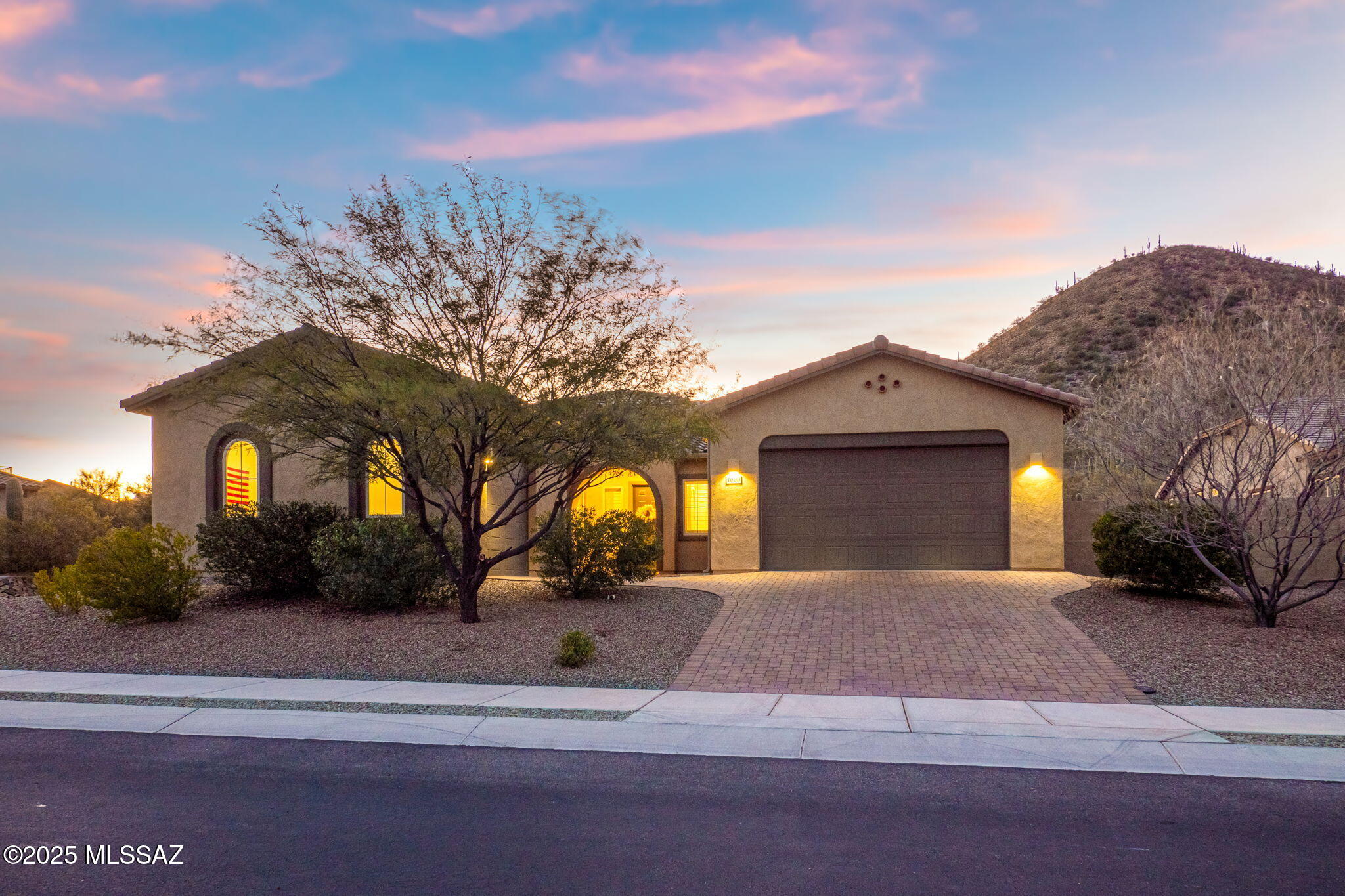 Nestled against a stunning backdrop of saguaro-studded desert scenery, this exquisite 4-bedroom, 3-bathroom home offers unparalleled tranquility and breathtaking sunsets painted in deep oranges and purples.

Step inside to discover soaring ceilings and a thoughtfully designed open floor plan. The gourmet kitchen features ample cabinetry and is perfect for entertaining. Beautiful tile flooring flows throughout the home, complementing the custom-tiled showers and modern finishes.

A bonus or flex room provides versatility to suit your lifestyle. As an Energy Star-certified home with owned solar panels, this property combines comfort and efficiency.

Outside, enjoy the ultimate oasis with a sparkling pool and spa surrounded by elegant pavers, perfect for relaxing or entertaining.