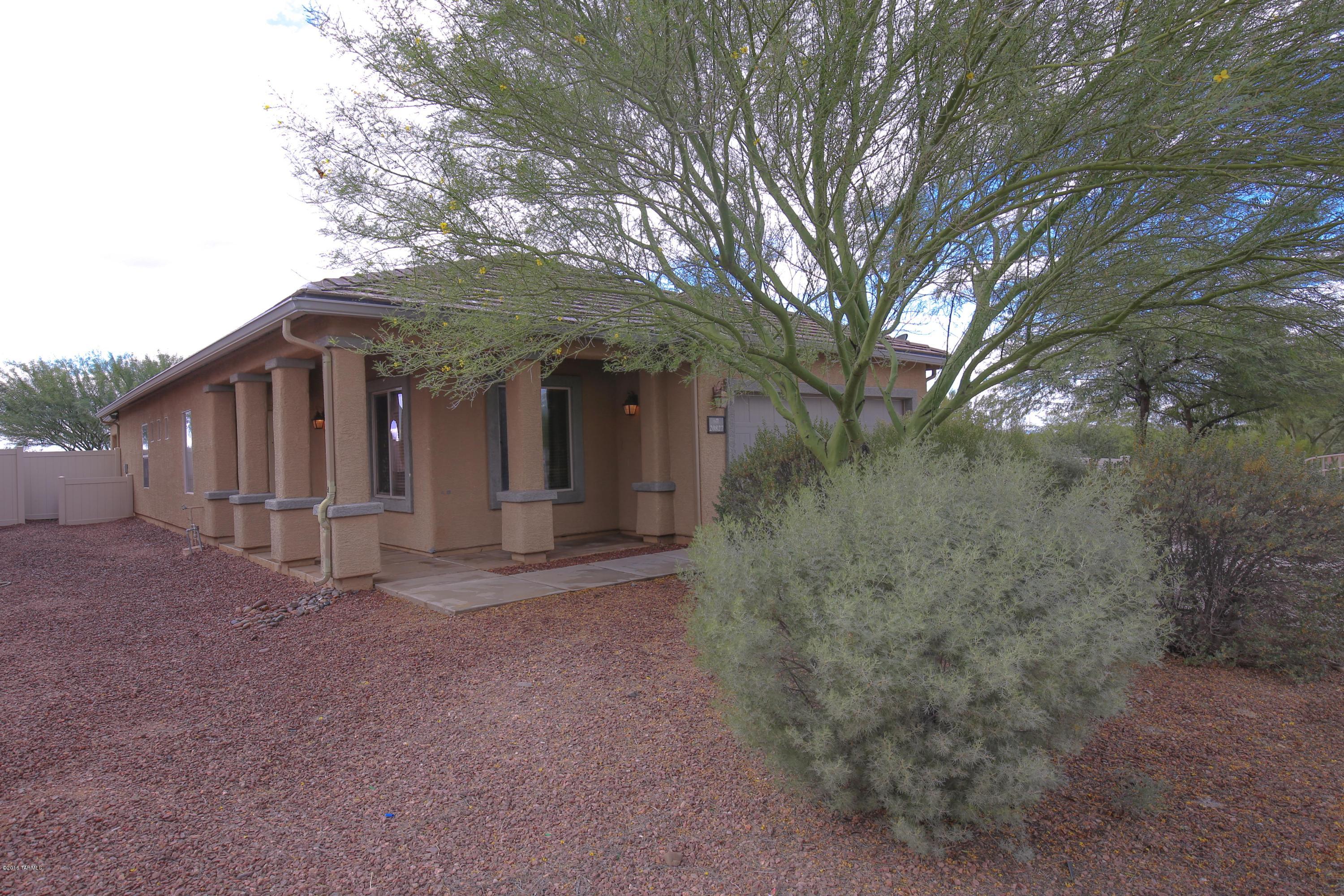 Come see the sunsets in this corner lot with open desert behind located in the master planned community of Red Rock Village just north of Marana. Great appliances and extras such as elegant front porch entry. Covered patio, ceiling fans, landscape drip system and beautiful tiled floors. Get outdoors and enjoy lighted softball fields, basketball courts, volleyball courts, neighborhood parks,trails, swim park, skate park, and new schools.