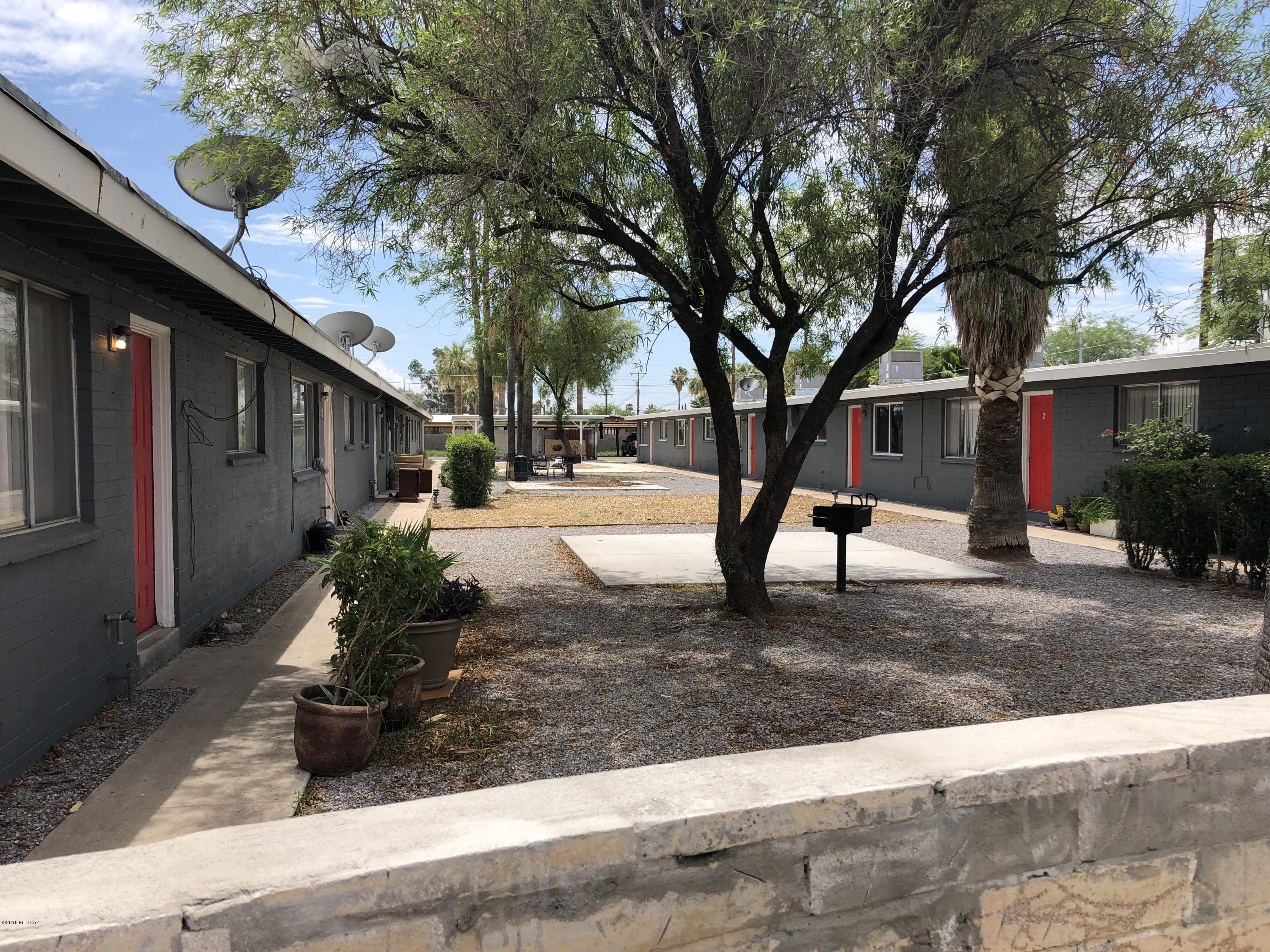 Terrific high cap rate 12 Plex property that's totally turn key and in very popular area of mid-town Tucson which is in very short supply regarding rentals and that is now experiencing extremely high rental demand, thus giving the next owners explosive potential to increase NOI. The current owner has in the last year invested a very significant amount upgrading everything including new AC's given in place of swamp coolers, roof work, windows, electric, paint and fascia work, plumbing upgrades, heaters, landscaping and cosmetic issues. Several of the units have been fully upgraded inside with respect to floors, paint, kitchens and bathroom remodeling. There will be no or nearly no capital expenditures for the next owners because this property has already had nearly everything possible done to it in the way of upgrading this past year. The property has on site covered parking and on site laundry facilities. These units are always rented out and it's owners report receiving 30+ inquiries per day via phone and many more online whenever one becomes vacant. Rents are far below market rate for the area while most of the rents are set to increase approximately $50/month in early '19. It can be easily verified through sites such as Zillow that the market rate for 2 bedroom rentals in this particular area of town currently are at least $900+ per month. This properties configuration is 9 two bed one bath units that are able to receive at least $725-$750/mo. rent while there are three one bed units that can receive at least $625-$650/mo. All units have 810 total sq. ft. This property currently generates $8,205 per month in rents though that is escalating rapidly given market conditions combined with the amount of upgrading last year especially including the new AC units installed. The monthly gross rent is now at very nearly 1% of the total purchase price while with big future upward mobility potential.