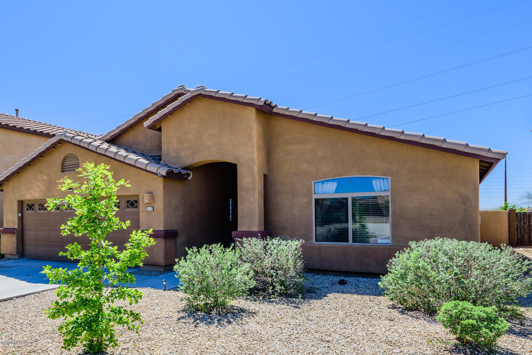 This is truly a home not to be missed.  Enjoy the spacious 4bd/2 ba 1933 Sq Ft quality D.R. Horton built sanctuary that boasts Solar, water softener, stainless steel kitchen appliances, blinds throughout, ceiling fans, alarm, spacious family room with separate, versatile living and dining areas for entertaining!   The tastefully appointed backyard has artificial no care grass and a large deck with retractable awning for relaxing evenings and no rear neighbors!!  All of this is situated in the sought after master planned Ranch Sahuarita Communtiy with parks, pools, gym, skate park, walking/bike trails, dog parks, 11 acre lake and much more!! Minutes from shopping, dining, I-19 shopping and entertainment corridor, Desert Diamond Casino and Madera Canyon!!  Come and get it before it goes!!!