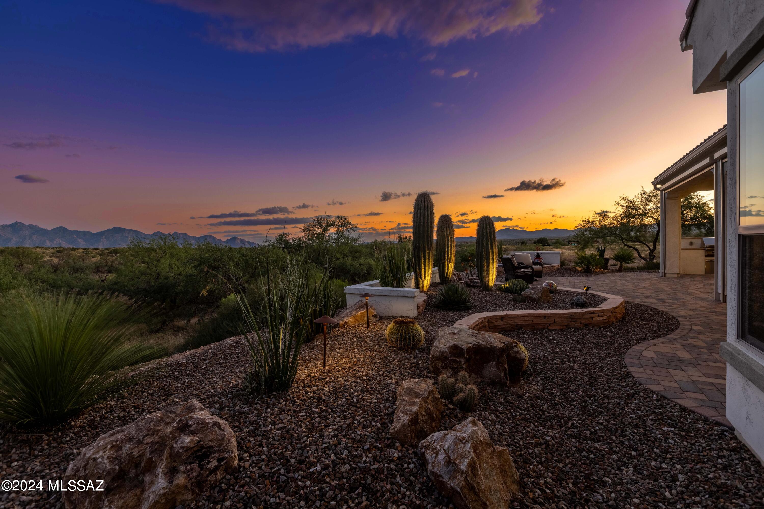 Location, Location, Location! Perched at the edge of Saddlebrooke Ranch with unobstructed, breathtaking views of the entire Catalina Mountain range, Mt. Lemmon and the Tortilitas. This is by far the premier location at the Ranch with total privacy and a southeast exposure with a 180-degree view to enjoy both the sunrise and the sunset without seeing another house. 
The Solstice model is perfection from the minute you walk in the front door and are dazzled with amazing views in this once in a lifetime property. But that's just the beginning. This impeccably thought-out home is an entertainer's dream with an oversized gourmet kitchen, quartz countertops, farmhouse sink, leatherette granite island with a natural chiseled edge and spacious walk-in pantry. The great room w/surround sound is framed by a beautiful floor-to-ceiling wall of sliding windows that completely disappear leading to the rear patio.  Light the gas patio fireplace, close the remote rolling shades and it's an incredible new entertaining space which showcases a beautifully landscaped rear yard for taking in the stunning views. The Primary suite with upgraded extension enjoys the same expansive Mt. views complete with luxurious en-suite bath with zero entry shower and spacious walk-in closet leading directly to the laundry room. 
The guest wing offers a private sitting room adjacent to the guest bedroom and en-suite bathroom for guests' ultimate comfort and privacy. The separate den/office, with built in cabinetry, is large and designed for any game night, hobby or working from home. An extended 3 car garage provides plenty of space for cars, golf carts and toys and plenty of room for working on projects. A home like this rarely comes to market and we look forward to sharing this very special property with you. Why wait to build when you can start enjoying all the amenities that SaddleBrooke Ranch has to offer.