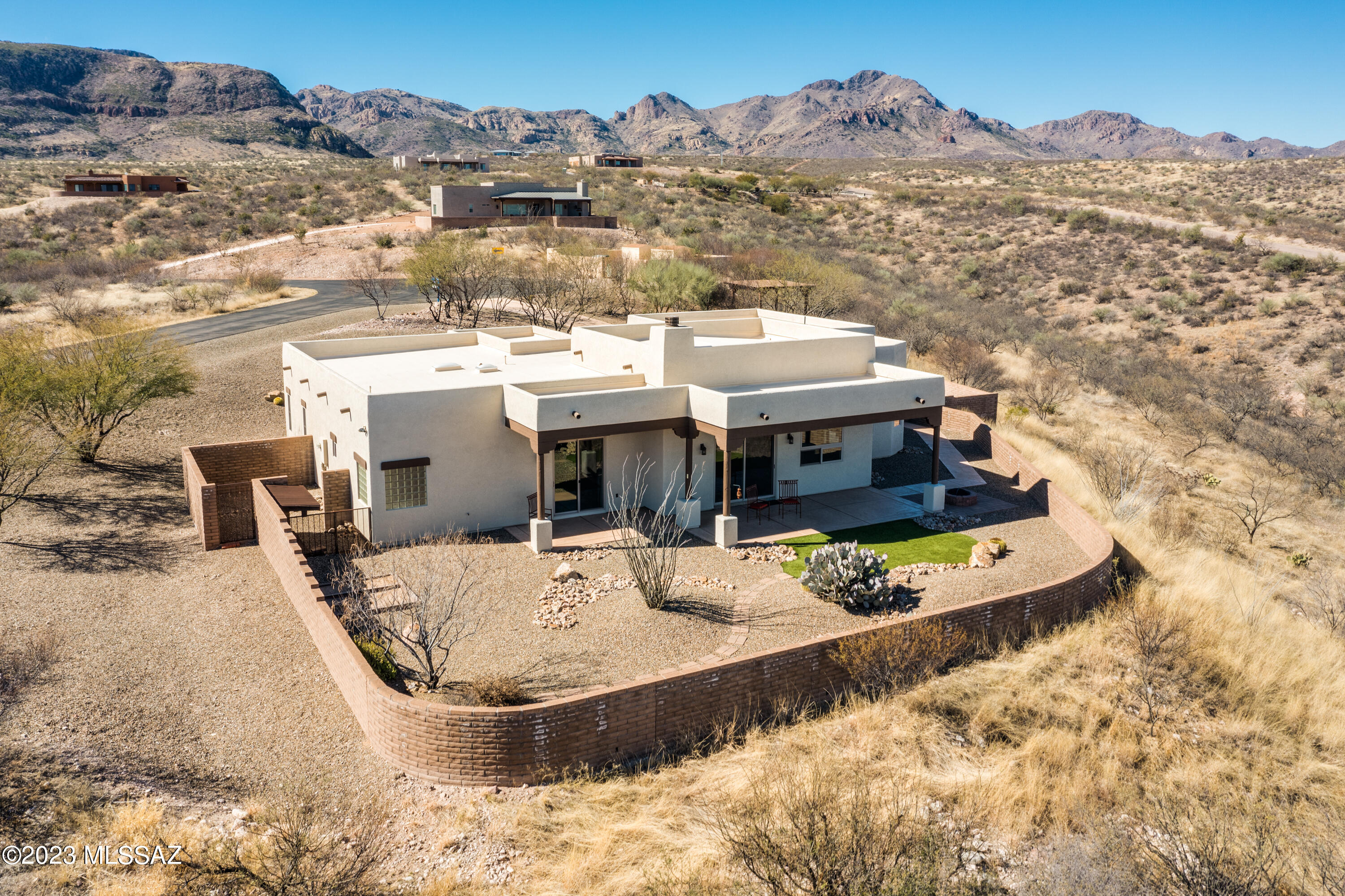 Southwest living at its best!  This authentic hacienda-style home sits on 4 acres of spectacular natural desert at the exclusive ''Ranch at Aliso Springs''.  Soaring high above Tubac, but just minutes away, this very special property has panoramic views that will take your breath away.  Embodying the warmth and spirit of the southwest, the home has high ceilings, a kiva fireplace, stunning rock work, tile floors, exposed beams, rustic hickory cabinets, eight-foot Alder doors and more.  The spacious owner's suite features a large walk-in closet, garden tub, separate walk-in shower, and private patio access.  The bonus room/den with separate access is the perfect artist's studio or office.  The oversized garage and laundry room provide plenty of storage.  All this plus a charming outdoor