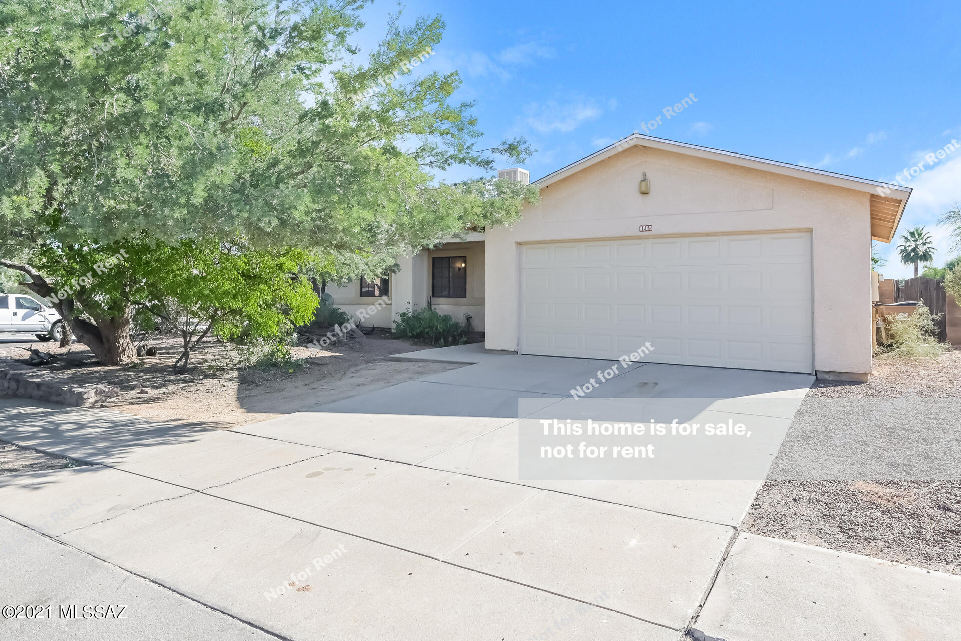 Absolutely Charming single level Home w/3bedrooms, 2 baths, & an open floor plan.  Soring ceilings, cozy fireplace for the chilly AZ evenings, soothing palette, & ceiling fans.  Spacious eat-in kitchen features beautiful tile floors, plenty of wood cabinets, & lots of counter space. Large bedrooms, ample closets, & pristine baths. Enjoy the backyard covered patio, mature desert landscape, shade trees, & room for a pool! Established & quiet neighborhood. Stop renting & take a tour today!