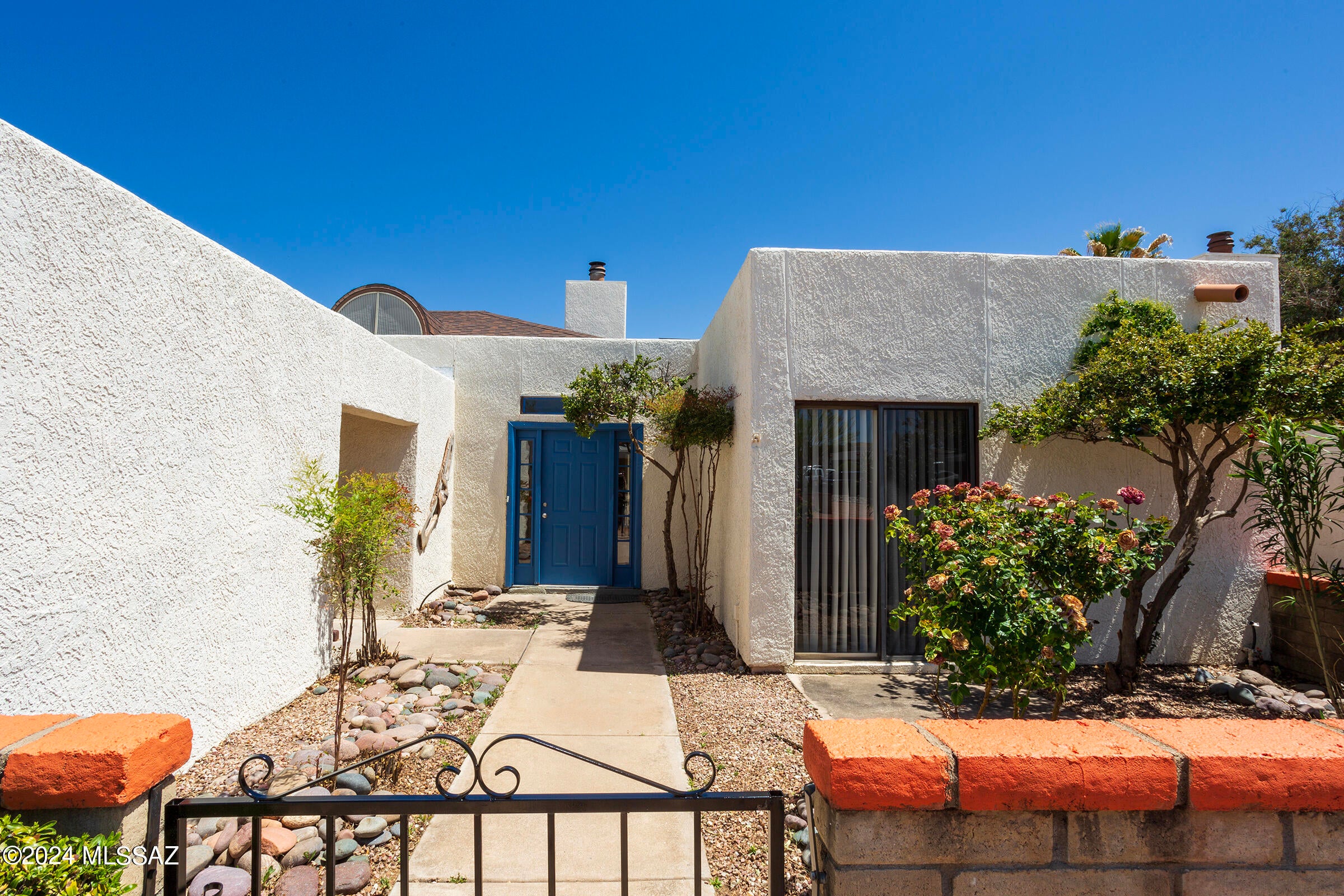 Move-In Ready RENTAL! This delightful townhome is located in the desirable gated community of Desert Dawn. Well maintained & features tile flooring throughout, new window blinds, central AC, a cozy wood-burning fireplace, & a convenient laundry room with access to carport. Each bedroom offers access to both the front courtyard & back covered patio, perfect for privacy to relax & enjoy the outdoors. Community amenities include a sparkling swimming pool, clubhouse, & nearby walking & biking paths. With beautiful mountain views & a welcoming neighborhood, this townhome is ready for you to move in, relax, & enjoy!