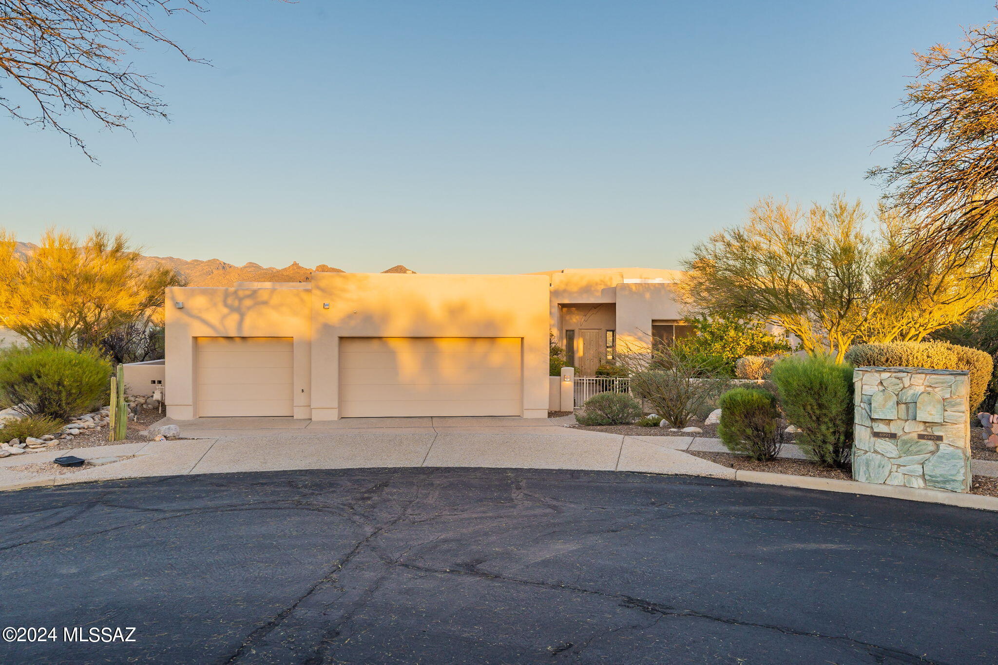If you are looking for views, look no further! Located in small gated community & situated on over 3 acres to capture unobstructed, stunning mountain views. Enter through charming courtyard & immediately be awestruck by the grandeur of endless views, perfectly framed by walls of windows.  Very clean, spacious 4BR/3BA split plan has been meticulously maintained & is move in ready. Enjoy city lights & entertaining on deep wrap around patio or in beautiful great room w/ fireplace & bar. Kitchen has abundance of cabinet space. Primary suite w/ patio access, jacuzzi bath, double toilets & large walk-in. Easy home to lock & leave w/ rolling shutters. New roof 12/23.  3 car garage w/ storage. Large laundry room, central vac, reverse osmosis, ceiling fans, wide hallways, close to hiking & dining.