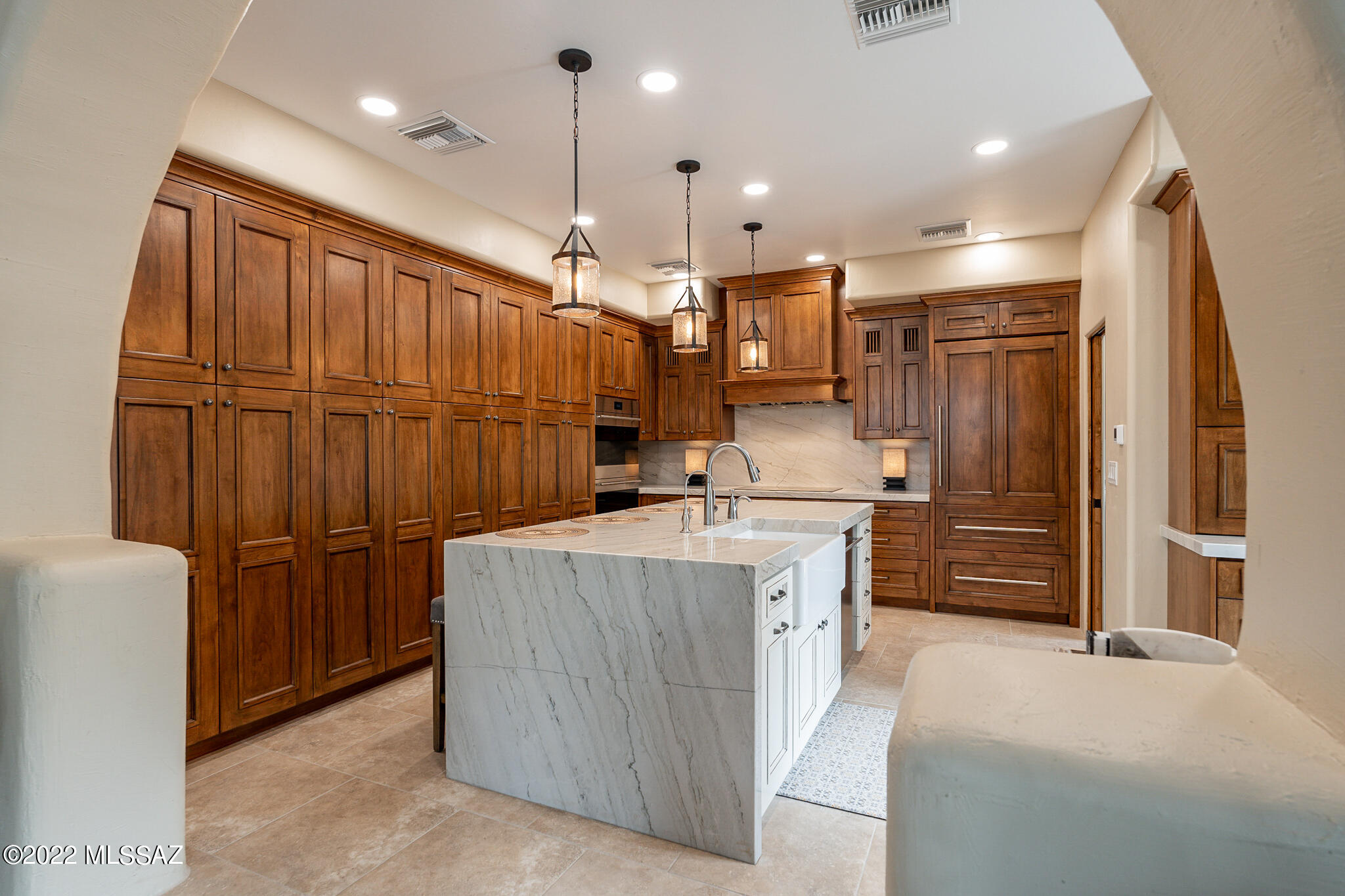 Truly a special opportunity to own a pristine completely remodeled luxury home with high-end finishes. Private country living at its finest w/ spectacular views of the Catalinas from this 1.91 acre lot. Entirely reimagined kitchen w/ raised ceiling, custom cabinets, huge island, Wolf double oven, Cafe cooktop, Asko dishwasher, Sub Zero built-in refrigerator, granite slab counters and more. Refinished pine ceilings & new tile flooring throughout w/ new flagstone around the fireplace. Large master suite w/ all-new bathroom plus walk-in shower and redesigned walk-in closet. Guest bath completely updated w/ custom cabs and granite slab counters. 2 car garage plus newly built detached big 4 car garage for all the toys!  AC and water heater less than 2 years old.  A unique opportunity!