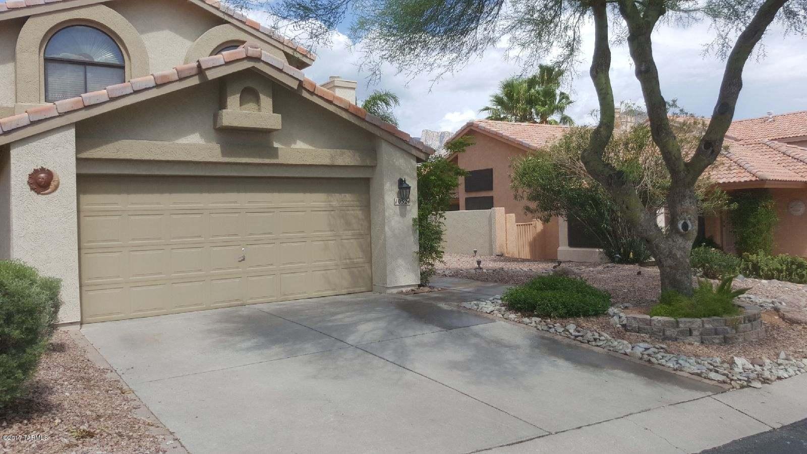 Immaculate 4 bedroom, 3 full bath home located in popular Oro Valley in a small and quiet subdivision. Newly remodeled kitchen, all kitchen appliances with full size washer/dryer included. Huge master suite with large sitting room,  remodeled bathrooms,   formal dining room, separate family room, high ceilings. New paint, newer tile throughout downstairs, extra storage in garage.  Sparkling pool with pool service included. Dog run, two air conditioning units, custom window treatments, breakfast nook/island,   On golf course, which provides great mountain/sunrise views! Walking distance to shopping, restaurants, trails and bike paths.  A great home that shows owners pride. No smoking or vaping. Owner/Agent