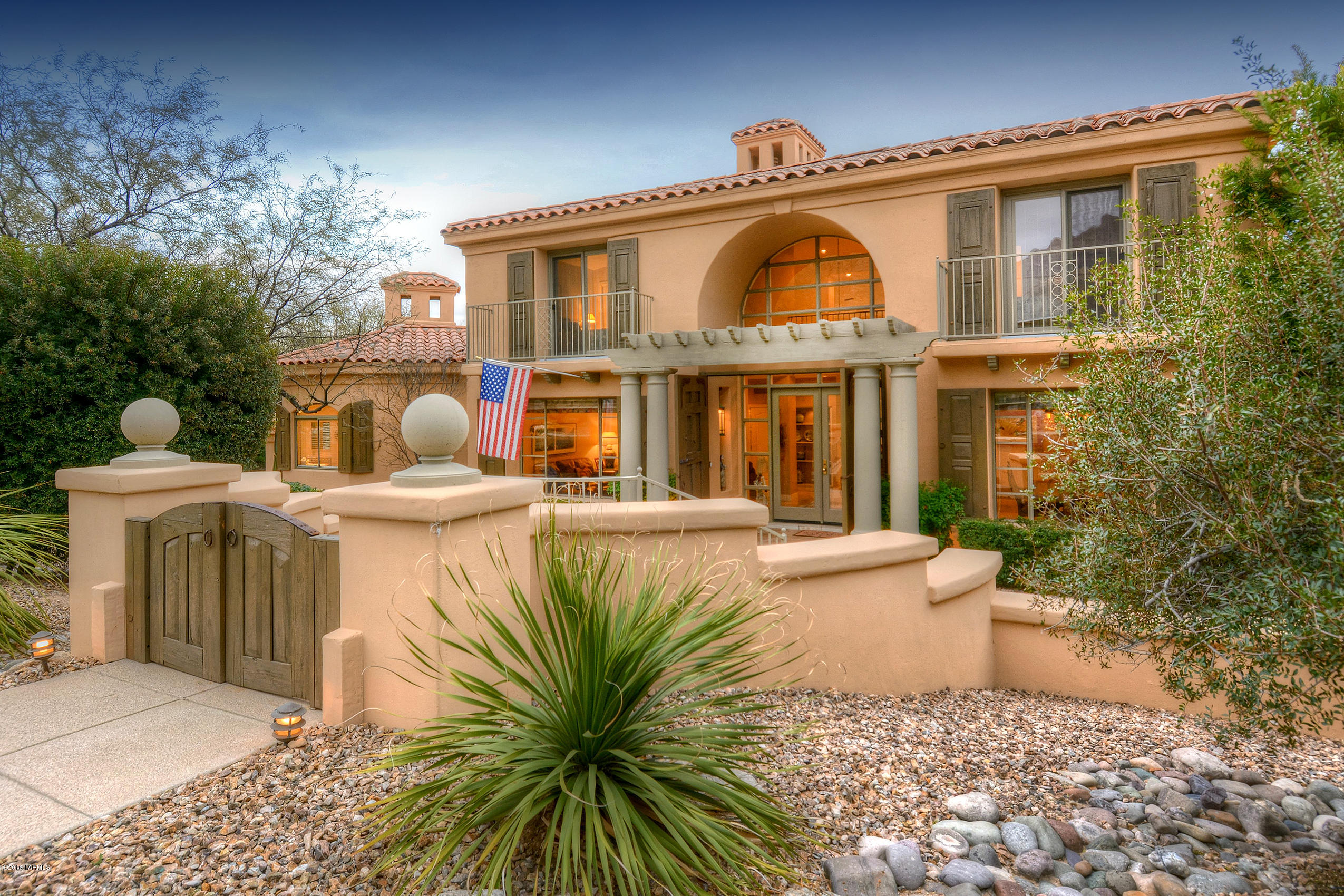 You’ll enter this open and bright Hacienda thru a 19th Century Mexican Zaguan entry, which is steeped in charm and history. Stone floors and a greatroom with floor to ceiling windows that look out to the private backyard oasis. A Main floor master with two guest bedrooms upstairs. Large laundry with enough space for a work/hobby room as well as a downstairs office. All the polybutylene pipes throughout the home have been replaced. So much attention to detail-from the Sue Betanzos artwork that adorns the greatroom windows, upstairs guest room and backyard, to the antique doors, purchased in Santa Fe, that now serve as decorative shutters adorning the exterior windows. If you are looking for your own private retreat close to the Ventana Canyon Golf & Racquet Club, you need to see this home