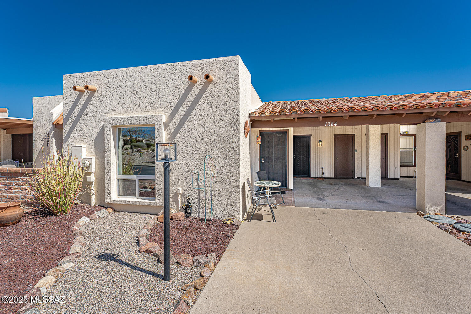 A lovely light-filled townhouse that you can call home full-time or part-time. Fully furnished including kitchen items, linens, etc. (the sellers will keep some smaller personal items). Mostly tile with wool Berber carpet in the living room only.  Kitchen has butcher block Formica and black appliances along with a large pantry closet. Some mountain views from the front area and a nice mtn view from the back patio. The patio concrete was painted by a Tubac artist for a beautiful accent. An additional patio cover was installed to offer extra shade.  Step outside the gate to an extended patio area to enjoy the wildlife and the mountain view. Trane HVAC installed in 2023 (15 SEER), roof recoated March 2024, Bill's Pest Control contract valid until March 2026.