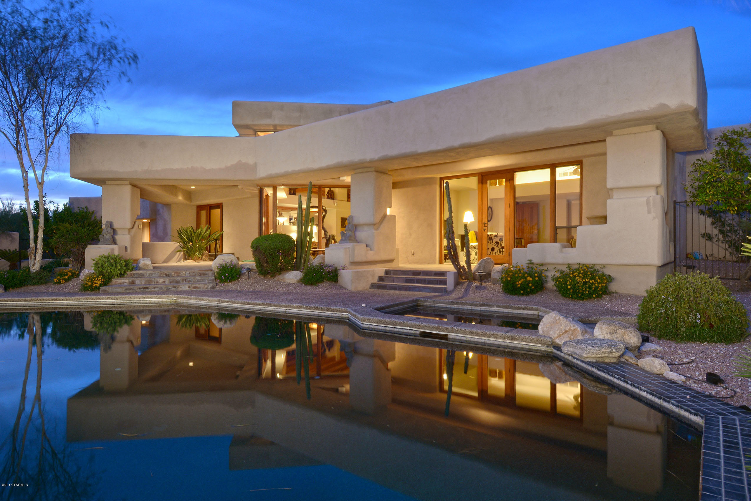 Stunning David Tyson designed Classic Southwest Contemporary flexible floor plan with Dramatic City, Mountain and Sunset views. Soaring wood beamed ceilings, clerestory windows, custom windows/doors, Hunter Douglas window coverings, perfect for indoor/outdoor entertaining. 4th bedroom suite was designed to accommodate a 5th bedroom. Gracious outdoor living areas including masonry fireplace and conversation area. Lovely landscaping, inviting Pebble-Tec pool/spa  . . . all the amenities.